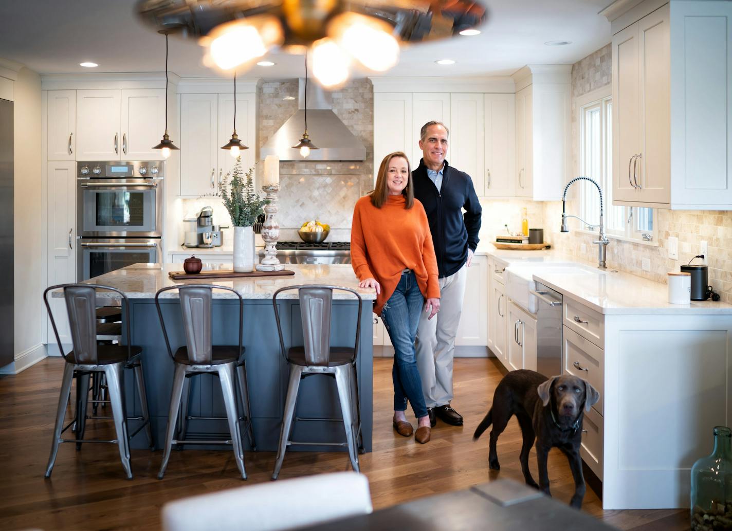 Kellie and Phil Schechinger, pictured with their dog, Marley, updated their Edina home to create an open floor plan.