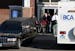 One of the 3 victims of a triple homicide is loaded into a hearse at the Willow Ridge Apartments in Vadnais Heights on Thursday, Oct. 14, 2010.