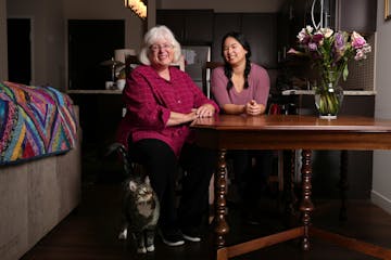 Marge Ostroushko with daughter Anna and Max the cat at home in Minneapolis. Getting rid of the table had been easy. Getting it back seemed to be impos