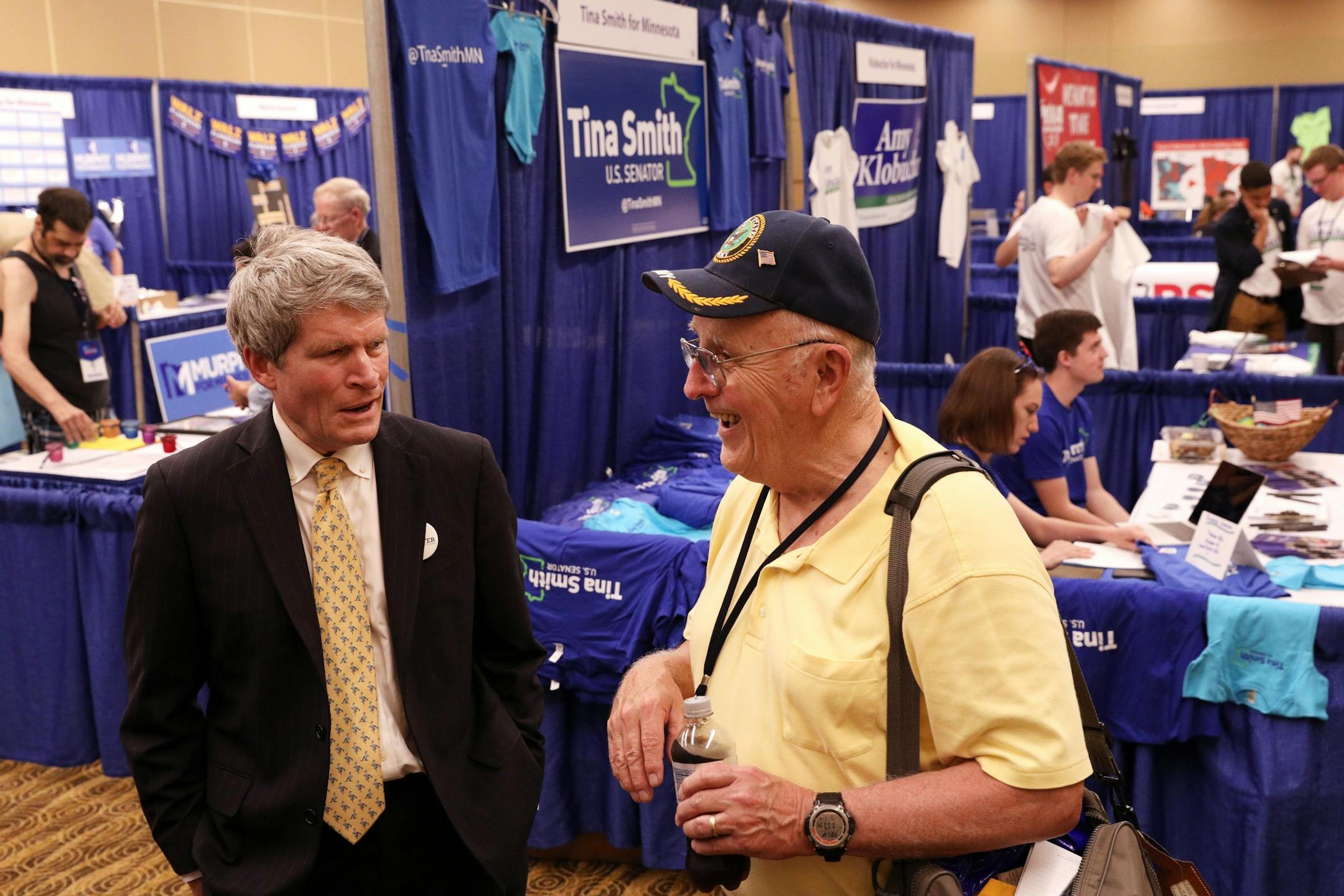 U.S. Senate candidate Richard Painter talked with delegate Lance Peterson during the DFL State Convention Friday.