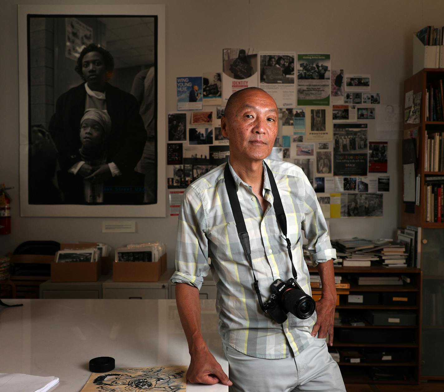 Photographer Wing Young Huie, this year's 2018 McKnight Distinguished Artist, posed for a portrait at his workspace Saturday. ] ANTHONY SOUFFLE &#xef; anthony.souffle@startribune.com Photographer Wing Young Huie, this year's 2018 McKnight Distinguished Artist, posed for a portrait at his workspace Saturday, Aug. 11, 2018 in Minneapolis.