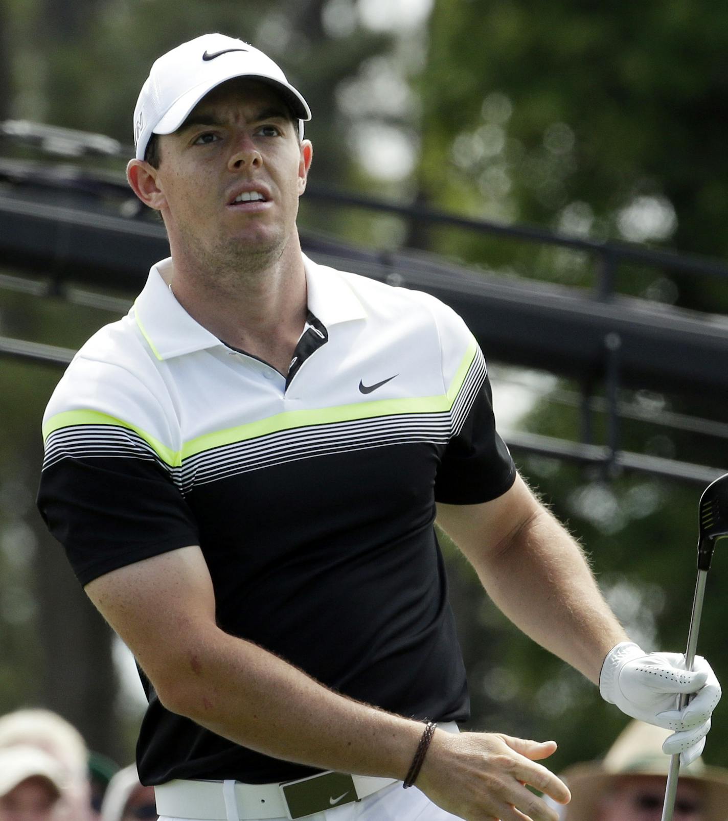 Rory McIlroy, of Northern Ireland, watches his tee shot on the first hole during the third round of the Masters golf tournament Saturday, April 11, 2015, in Augusta, Ga. (AP Photo/Charlie Riedel)