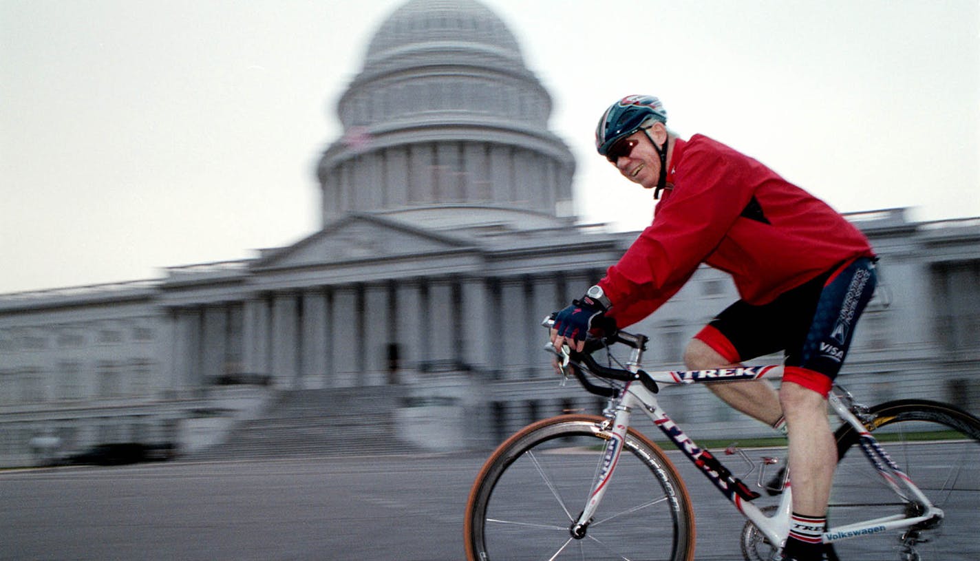 Congressman James Oberstar cycling around the US Capitol in Washington DC on hisTrek Tour de France 2000 racing bike which has a carbon fiber frame and graphite handlebars and seat post. April 12 2002. Photo: Melanie Burford ORG XMIT: MIN2014050316181340