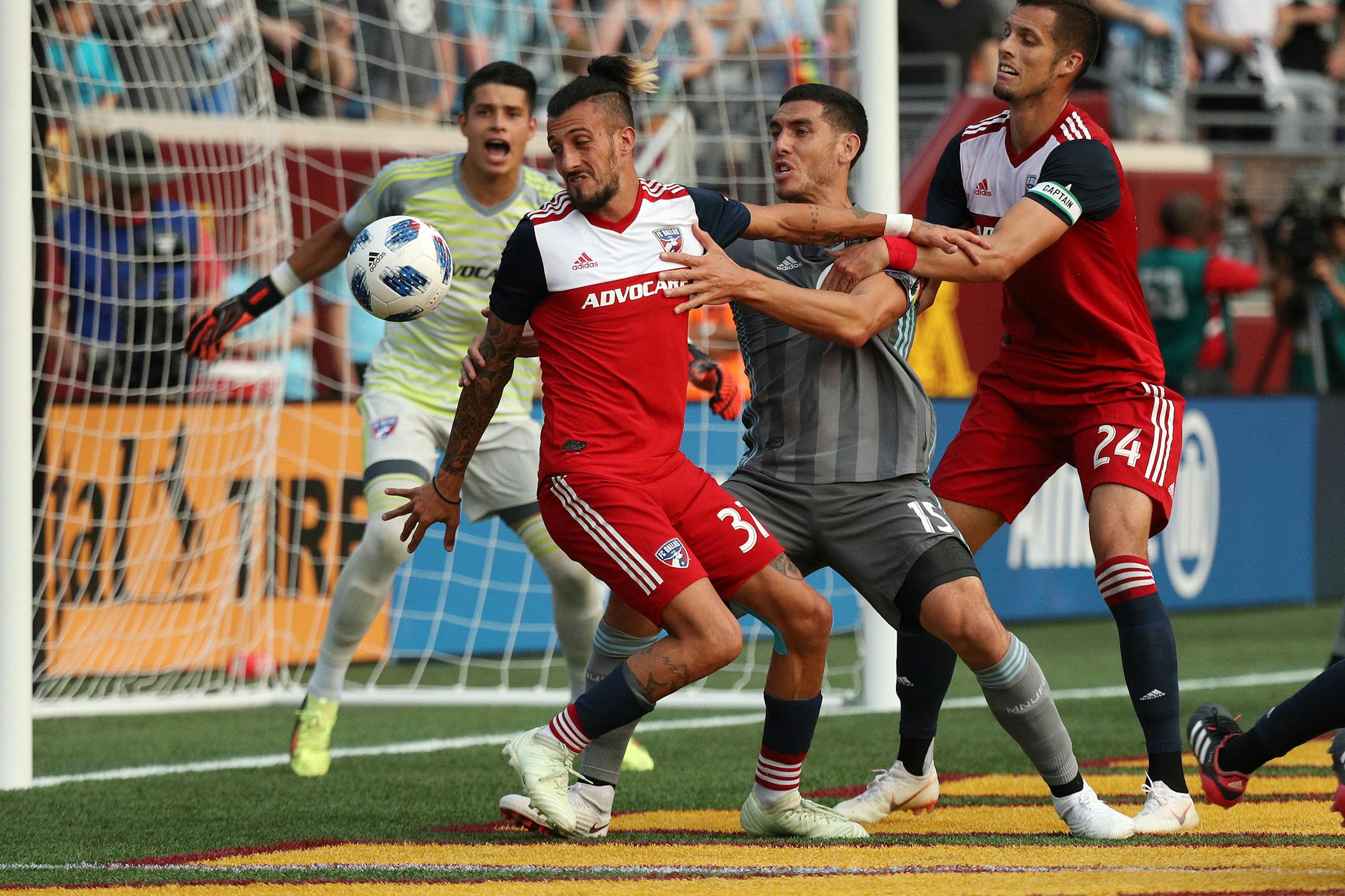 FC Dallas forward Maximiliano Urruti and United defender Michael Boxall (battle for the ball in front of the FC Dallas goal on Friday.