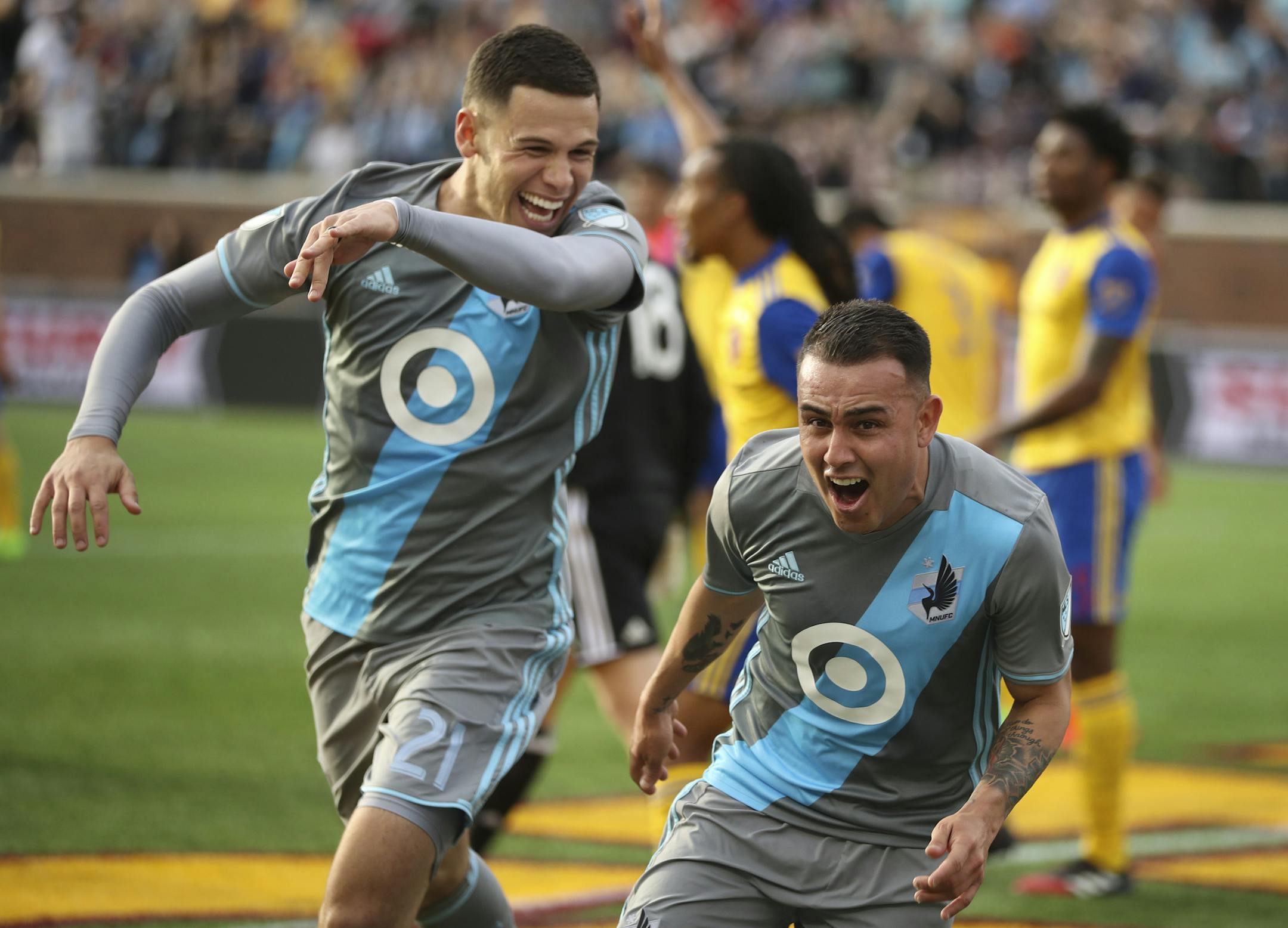 Minnesota United forward Christian Ramirez (21) helped Minnesota United midfielder Miguel Ibarra (10) celebrate.