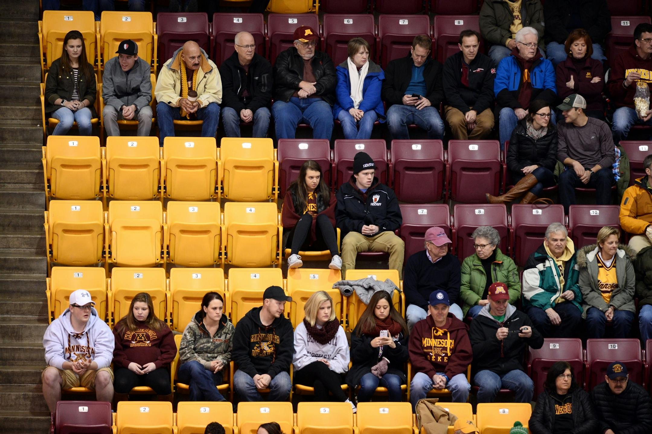 Fans sat in the stands during the third period Friday night during the Gophers men's hockey game against the Penn State Nittany Lions. The announced attendance was 10,053.