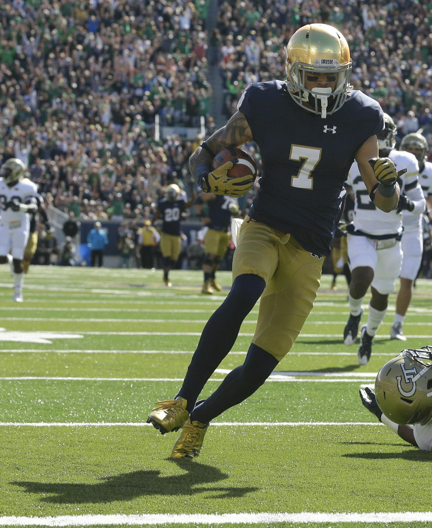 Notre Dame wide receiver Will Fuller (7) heads to the end zone for a touchdown after getting past Georgia Tech defensive back Chris Milton (6) during the first half of an NCAA college football game in South Bend, Ind., Saturday, Sept. 19, 2015. (AP Photo/Michael Conroy) ORG XMIT: INMC102