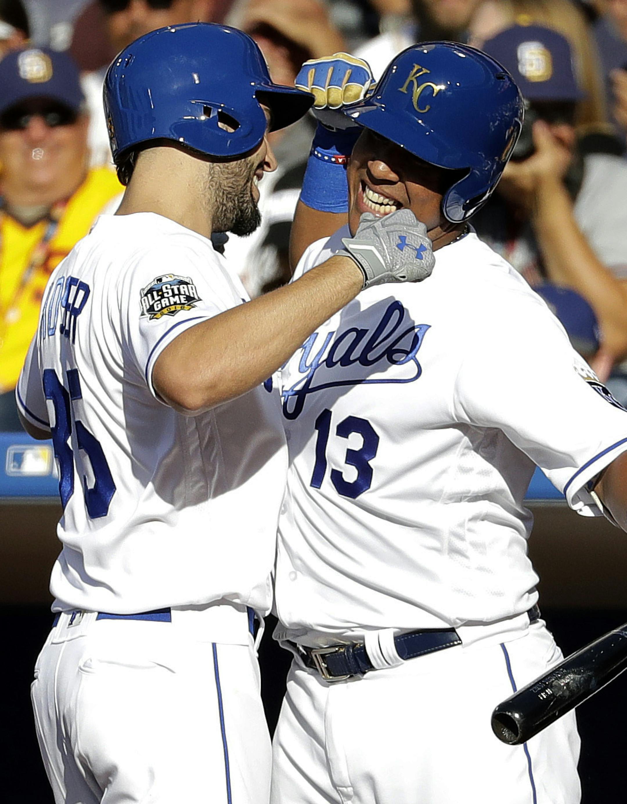 American League's Eric Hosmer, of the Kansas City Royals, left, greets teammate Salvador Perez, of the Kansas City Royals, after hitting a solo home run against the National League during the second inning of the MLB baseball All-Star Game, Tuesday, July 12, 2016, in San Diego. (AP Photo/Gregory Bull)
