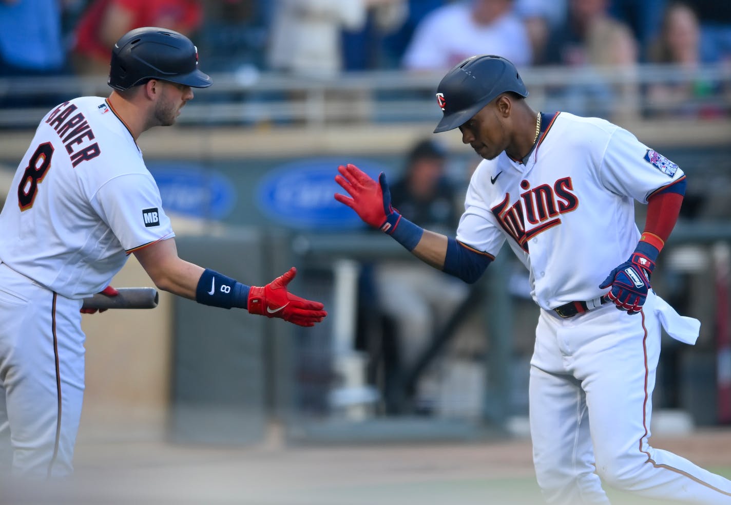 Minnesota Twins shortstop Jorge Polanco (11) high fived catcher Mitch Garver (8) after a solo home run hit by Polanco in the bottom of the second inning against the Baltimore Orioles.