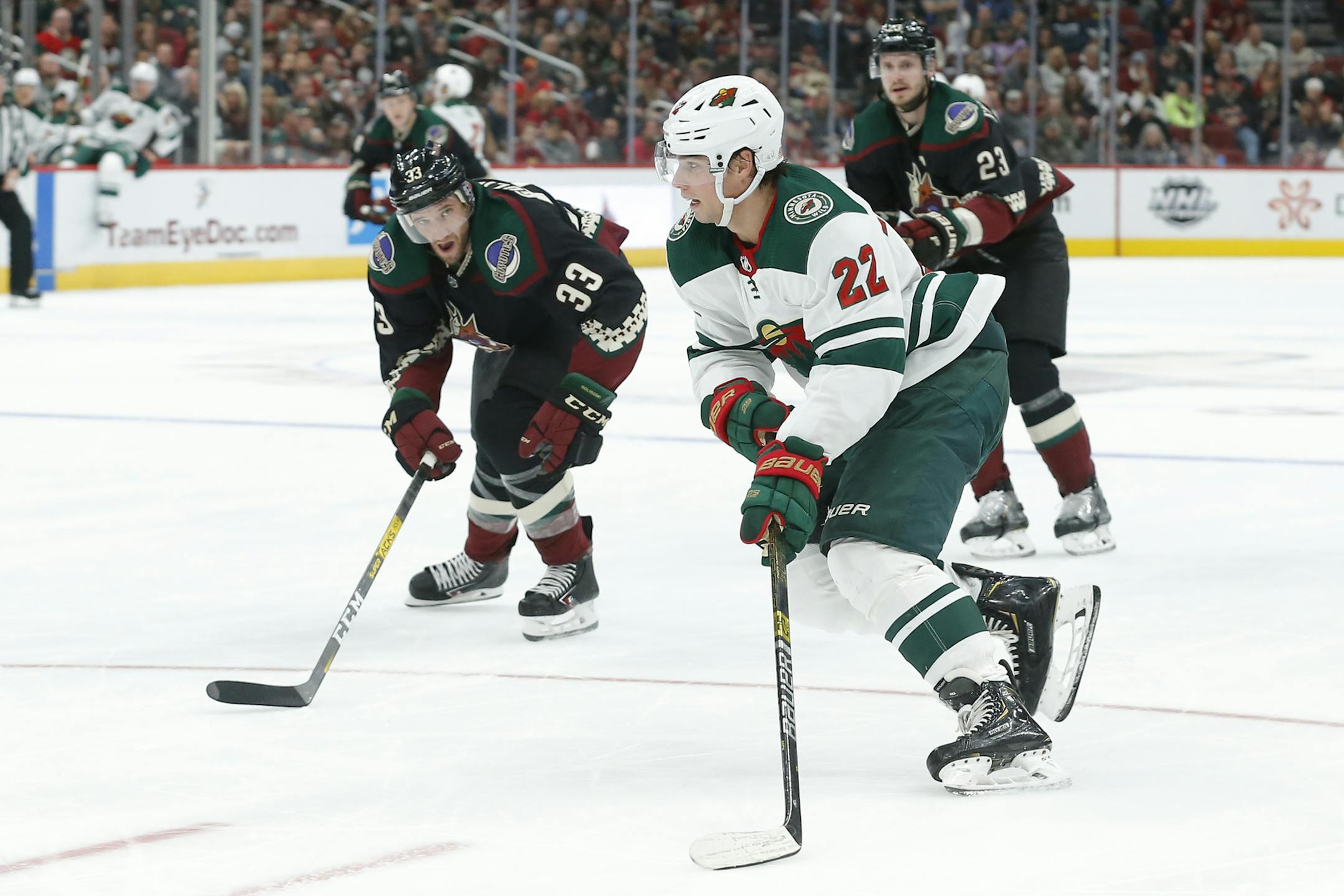 Minnesota Wild left wing Kevin Fiala carries the puck in front of Arizona Coyotes defenseman Alex Goligoski (33) in the third period during an NHL hockey game, Saturday, Nov. 9, 2019, in Glendale, Ariz. (AP Photo/Rick Scuteri)