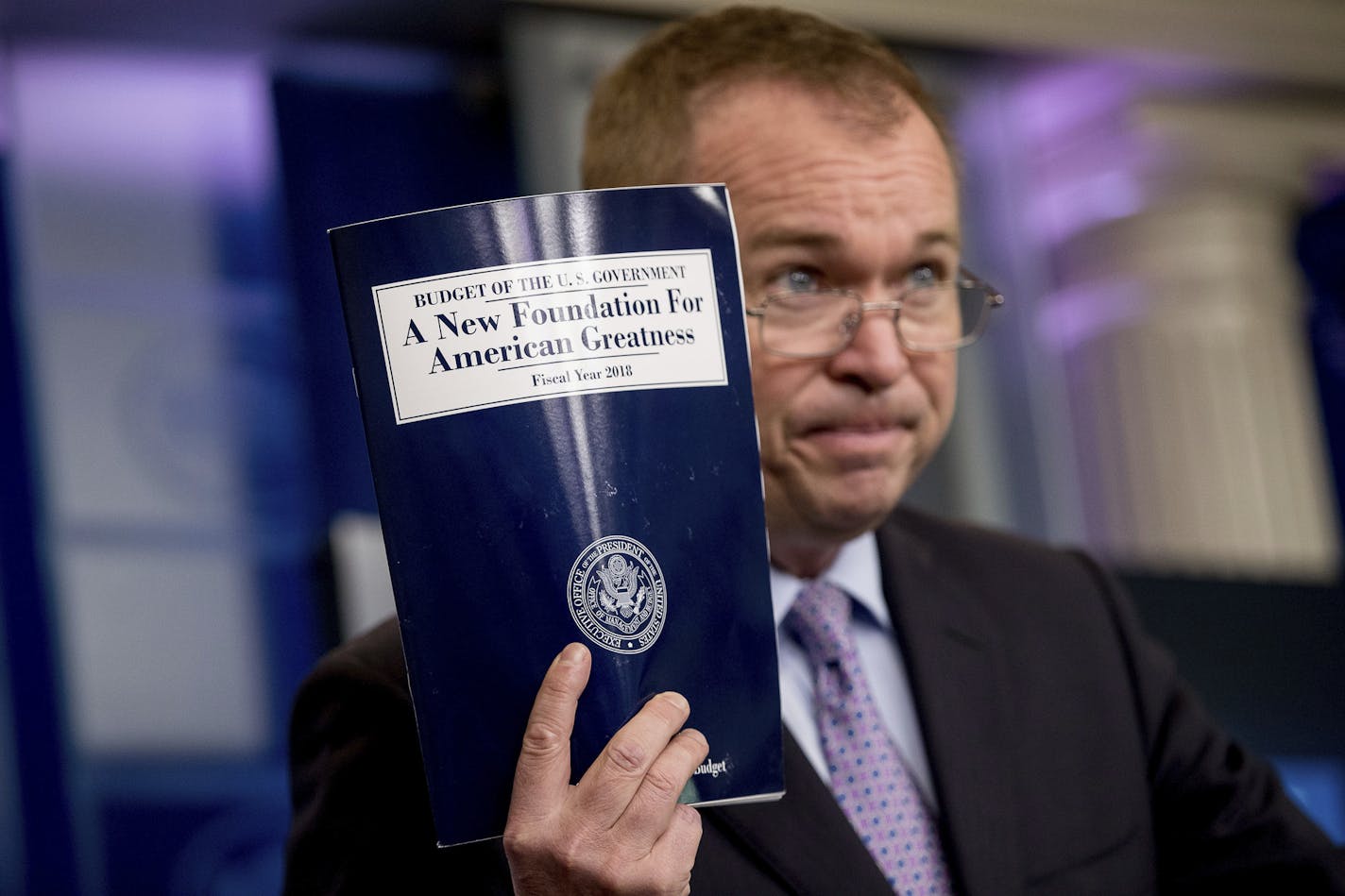 Budget Director Mick Mulvaney held up a copy of President Donald Trump's proposed fiscal 2018 federal budget in the Press Briefing Room of the White House in Washington on Tuesday.