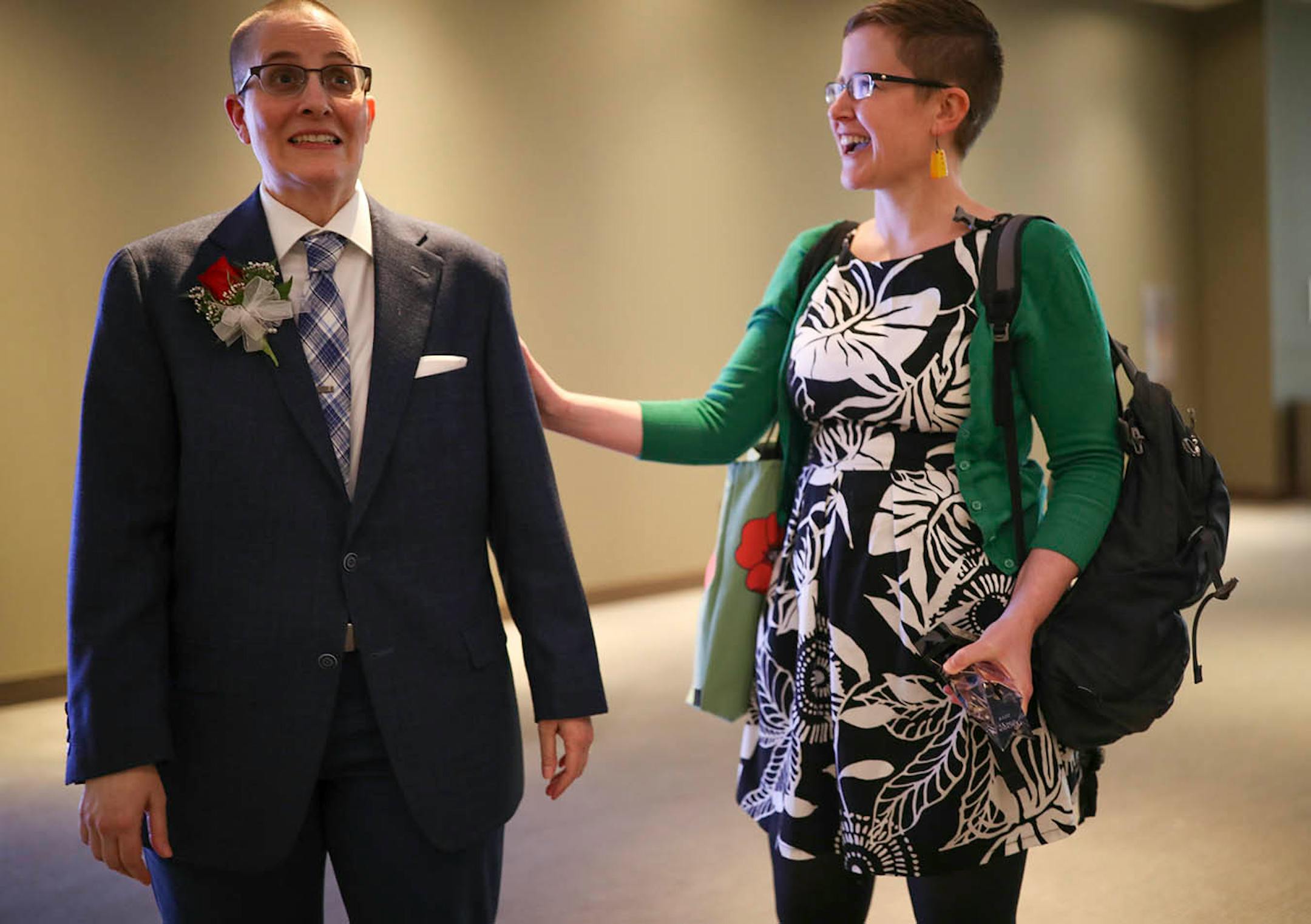 2018 Minnesota Teacher of the Year, Kelly D. Holstine, left, stood by her wife, Emma Freeman, after being named the 54th recipient of the honor Sunday afternoon. She was reacting just before being handed a cell phone to conduct an interview with MPR.
