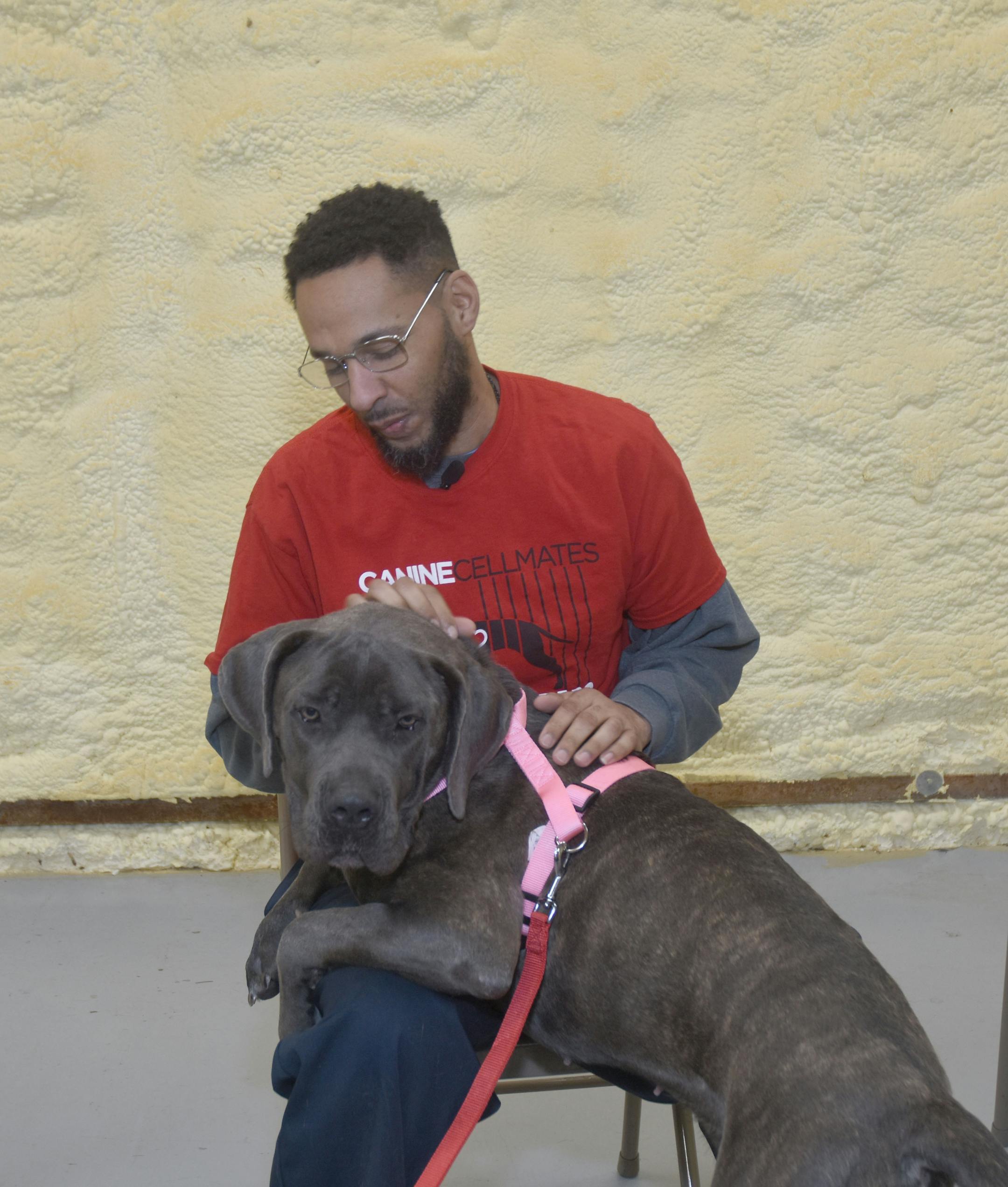 Jason Weese with Blossom, the Atlanta shelter dog he is training. MUST CREDIT: Canine CellMates