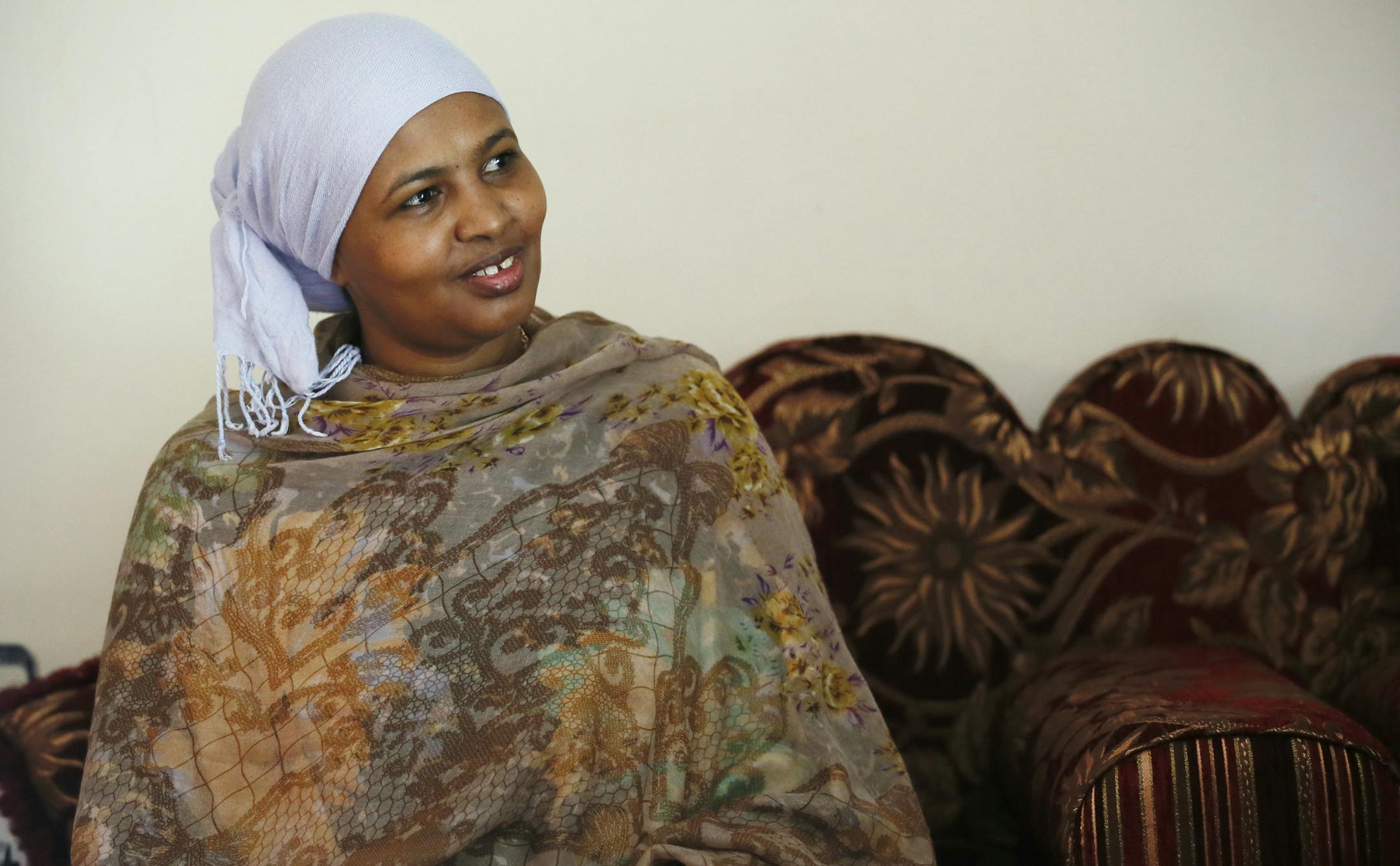 Fardosa Ibrahim rubbed her 4-year-old son Khalid hand as he rested in his bed. Fardosa is a educated nurse from Dubai and originally from Somalia, and son has cerebral palsy. She is try to help educated other members of the Somali community on how to seek help with their children with disabilities . ] JERRY HOLT ‚Ä¢ jerry.holt@startribune.com