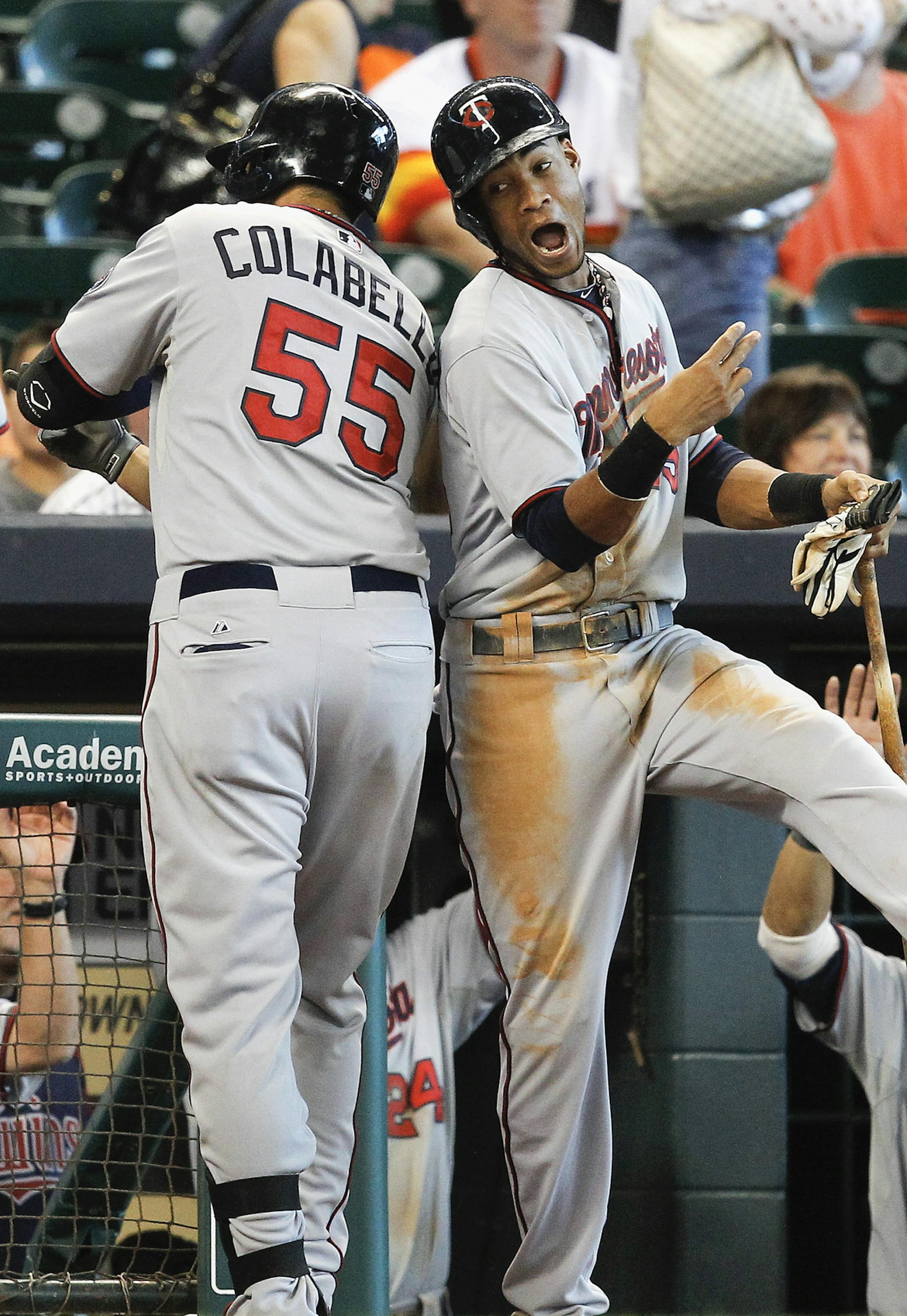 Chris Colabello celebrated with Pedro Florimon after hitting a grand slam in the ninth inning.