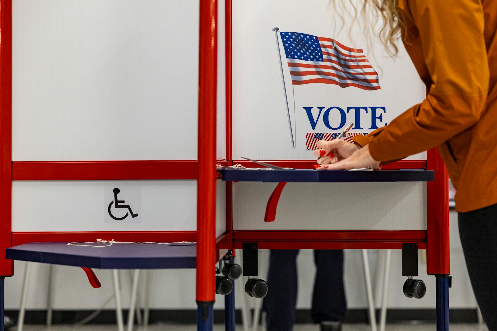Jenna Bullock fills out a ballot during early voting at Minneapolis Elections and Voter Services in Minneapolis on Thursday, Oct. 31, 2024.
