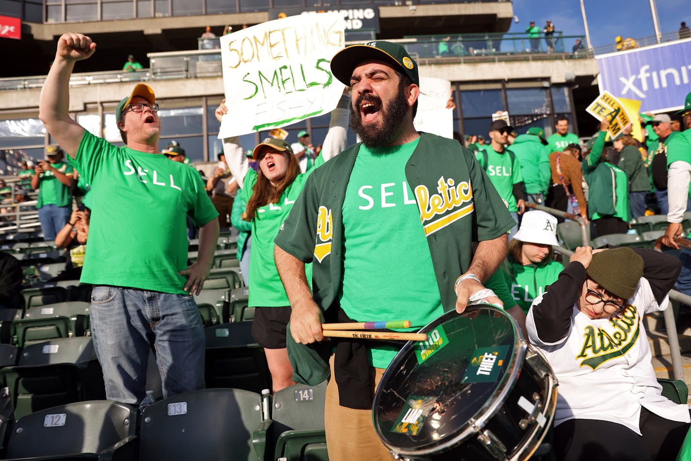 Oakland Athletics' fan Curt Silver drums while chanting "Sell the Team," at a baseball game between the A's and the Tampa Bay Rays at Oakland Coliseum in Oakland, Calif., Tuesday, June 13, 2023. Thousands of frustrated, heartbroken A's fans arrived early for tailgating and solidarity at the Oakland Coliseum ahead of a Rays-A's matchup to both celebrate their team and protest a planned relocation to Las Vegas. (Scott Strazzante/San Francisco Chronicle via AP)