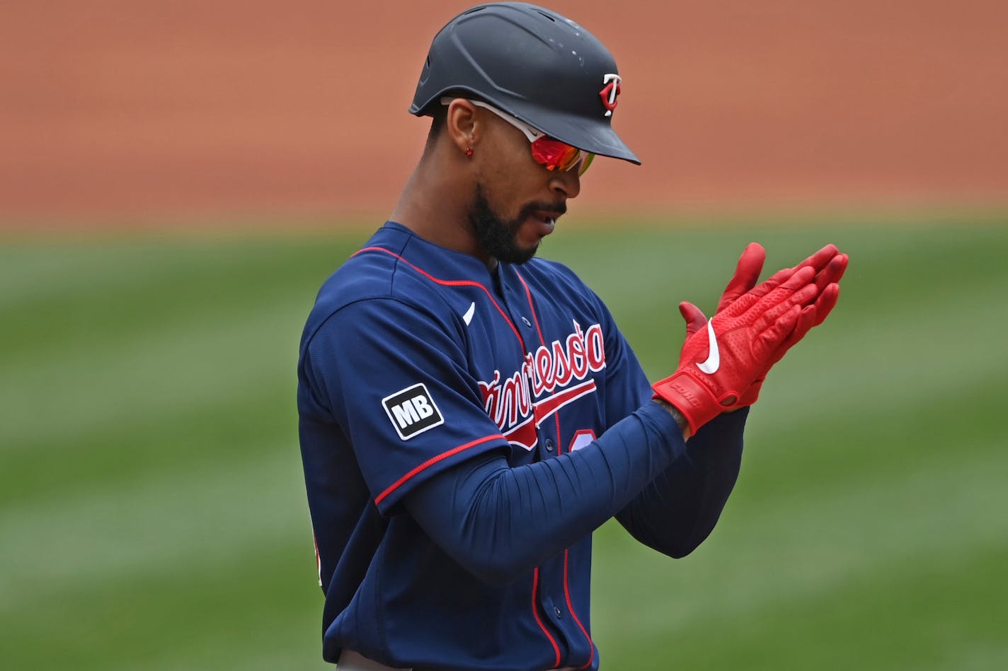 Minnesota Twins' Byron Buxton (25) celebrates after hitting a solo home run off Cleveland Indians starting pitcher Logan Allen (54) in the first inning of a baseball game, Wednesday, April 28, 2021, in Cleveland. (AP Photo/David Dermer)