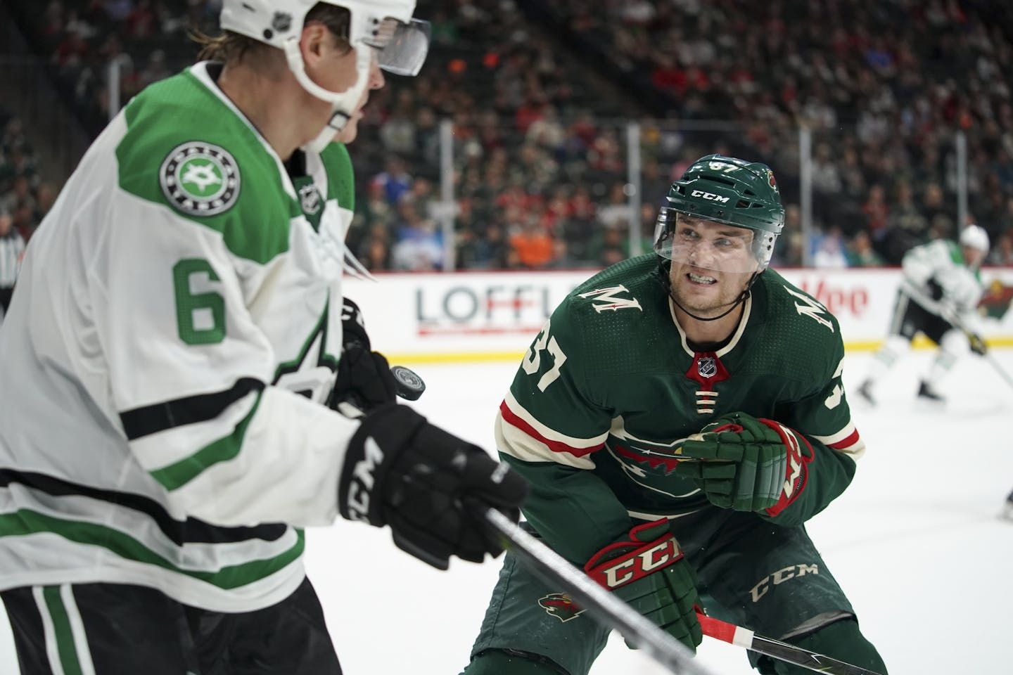 Minnesota Wild center Kyle Rau (37) took aim at Dallas Stars defenseman Julius Honka (6) before checking him into the boards in the second period. ] JEFF WHEELER • jeff.wheeler@startribune.com The Minnesota Wild faced the Dallas Stars in an NHL hockey game Thursday night, September 20, 2018 at Xcel Energy Center in St. Paul. ORG XMIT: MIN1809202211081170