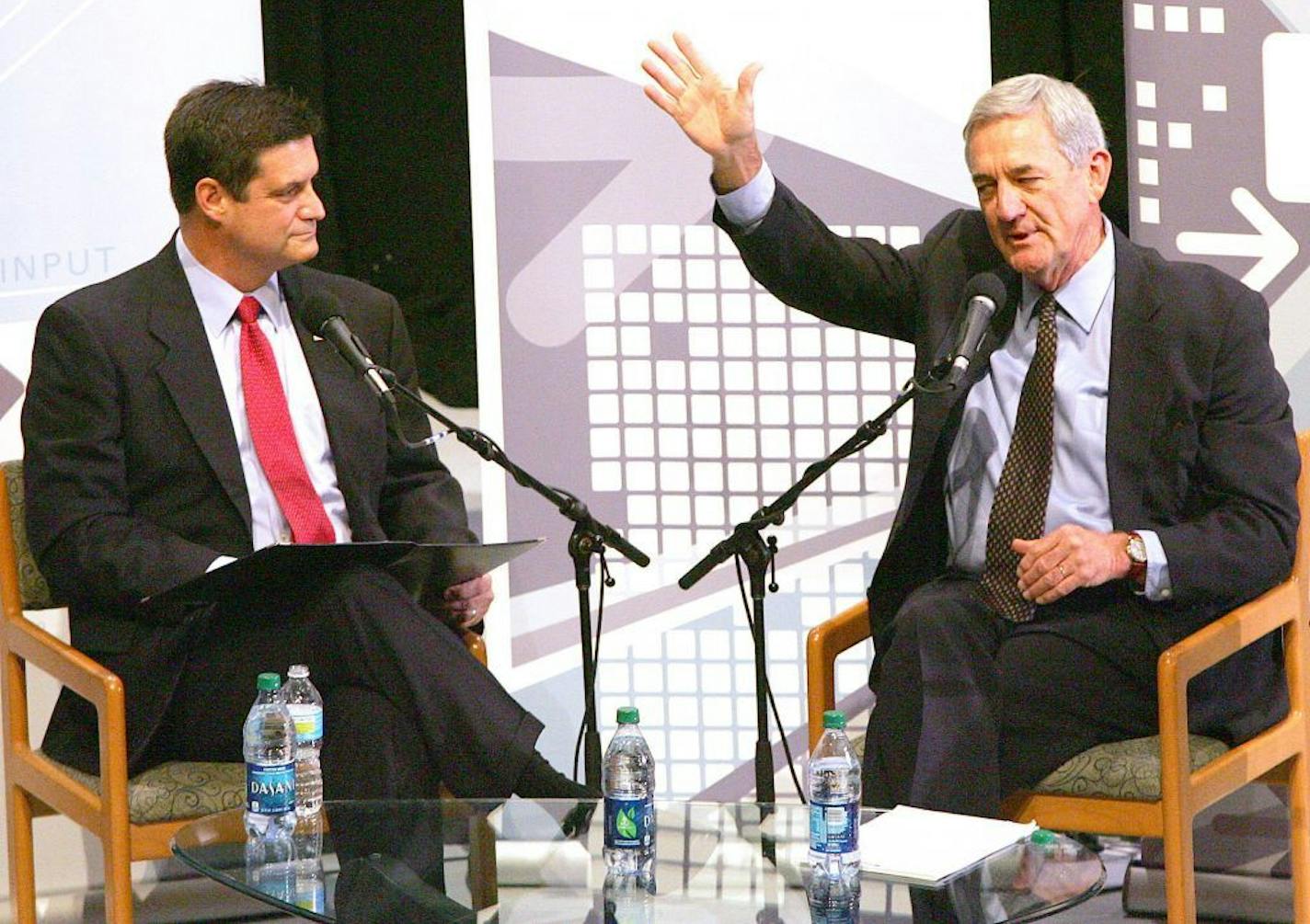 U.S. Rep. Chip Cravaack, left, R-North Branch, listens as Democratic challenger Rick Nolan makes a point during a debate in Duluth on Oct. 9.