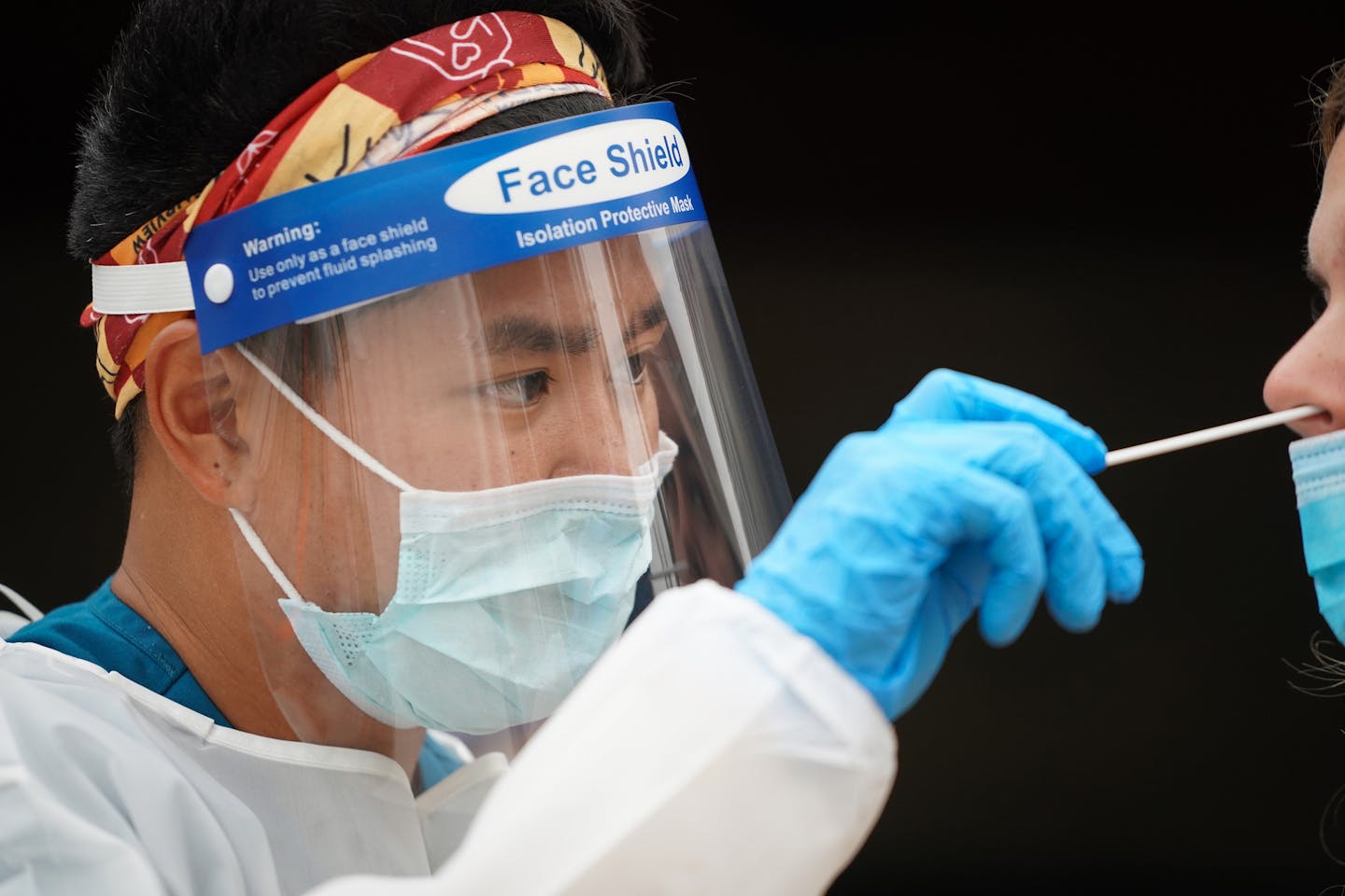 Hien Bui, an EMT with M Health Fairview and registered nurse, administered a COVID-19 test during a free testing event at New Salem Baptist Church in Minneapolis on Friday, Aug. 28.