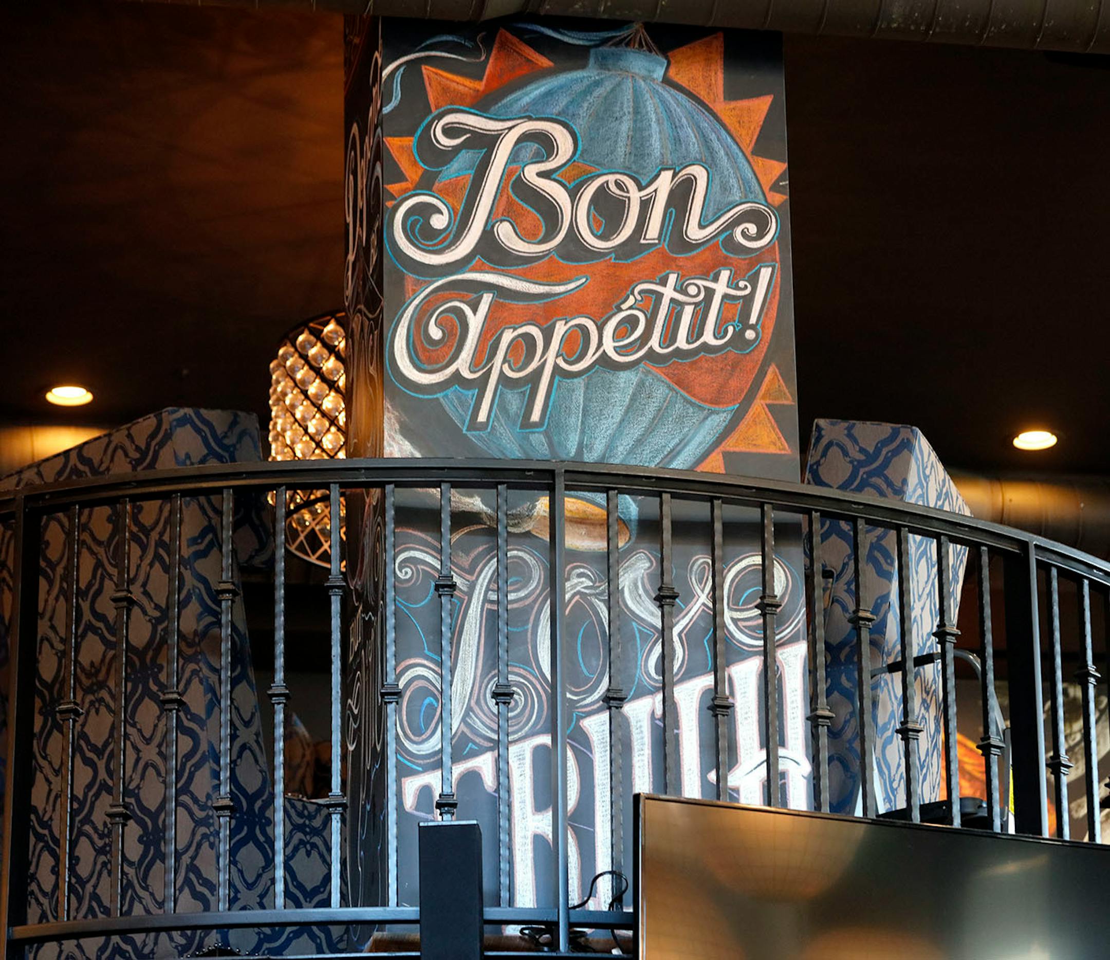 Adam Dennis work at Coup d'Etat restaurant in Uptown. Dennis' work include Smack Shack and the Pourhouse and is done with chalk and spray paint.