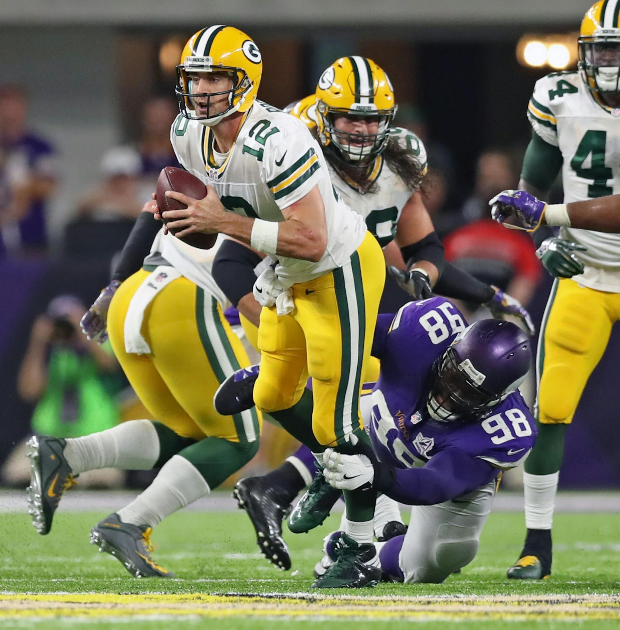 Vikings Linval Joseph sacks Packers QB Aaron Rodgers on their final drive.The Minnesota Vikings open the new US Bank Stadium for their first home regular season game against the Green Bay Packers. Here,