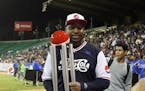 Former Twins outfielder Delmon Young, posing with his home run derby trophy