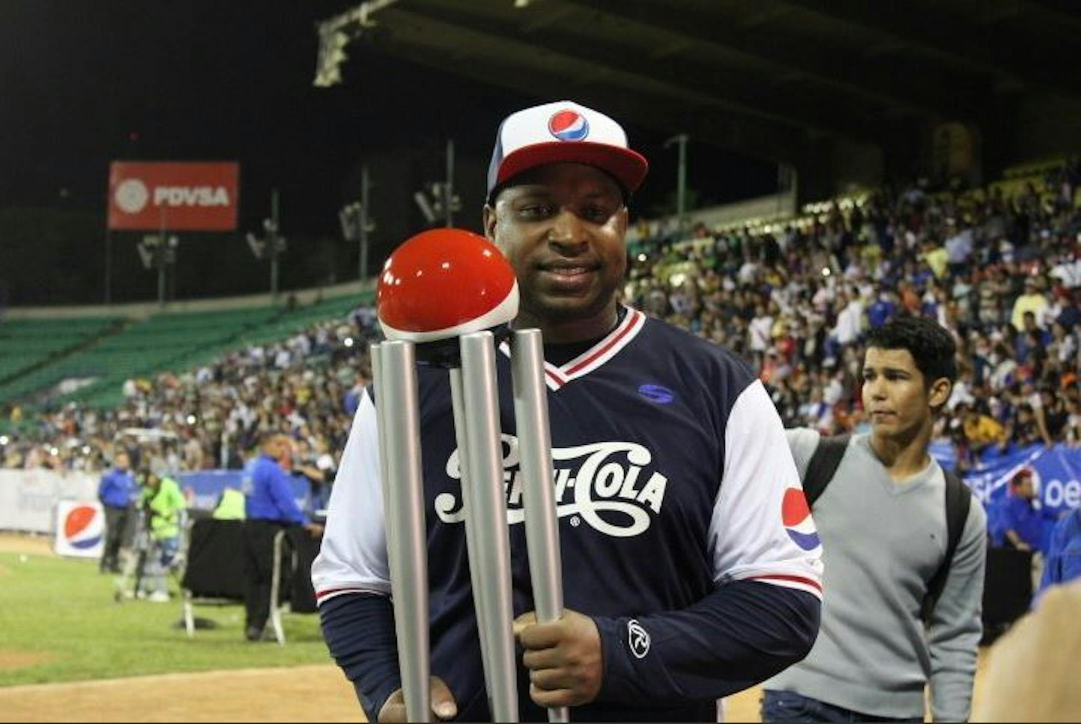 Former Twins outfielder Delmon Young, posing with his home run derby trophy