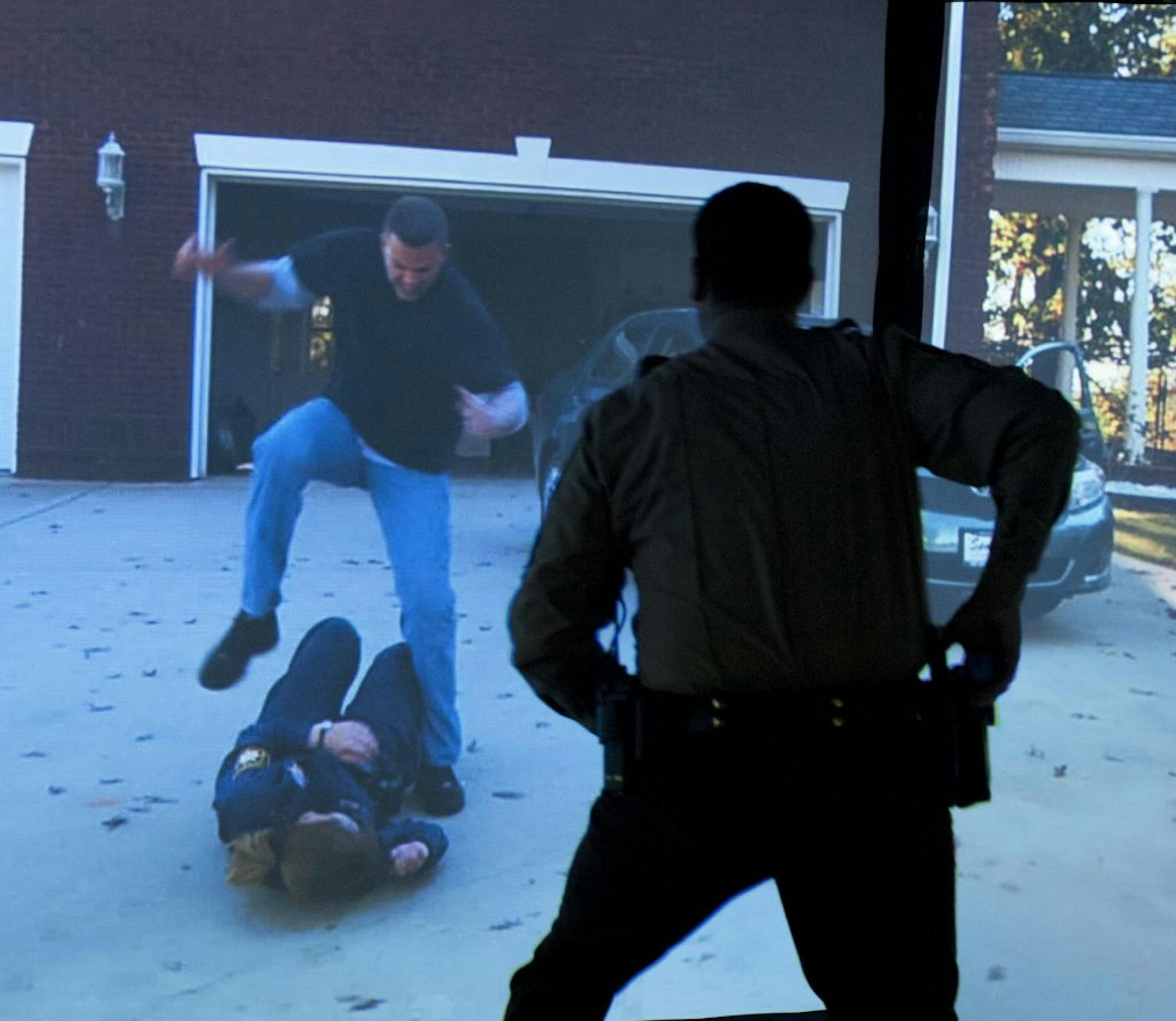 Sergeant Tim Samuelson of the Dakota County Sherriff's office trained in different realistic scenarios where firearms would be required. The scenes are projected on screens around the room allowing the trainee to move around and respond to movement from all directions. After a recent agreement with Gander Mountain Law Enforcement Sales, members of the Dakota County Sherriff's Office began training at Minnesota's only Gander Mountain Academy in Lakeville.