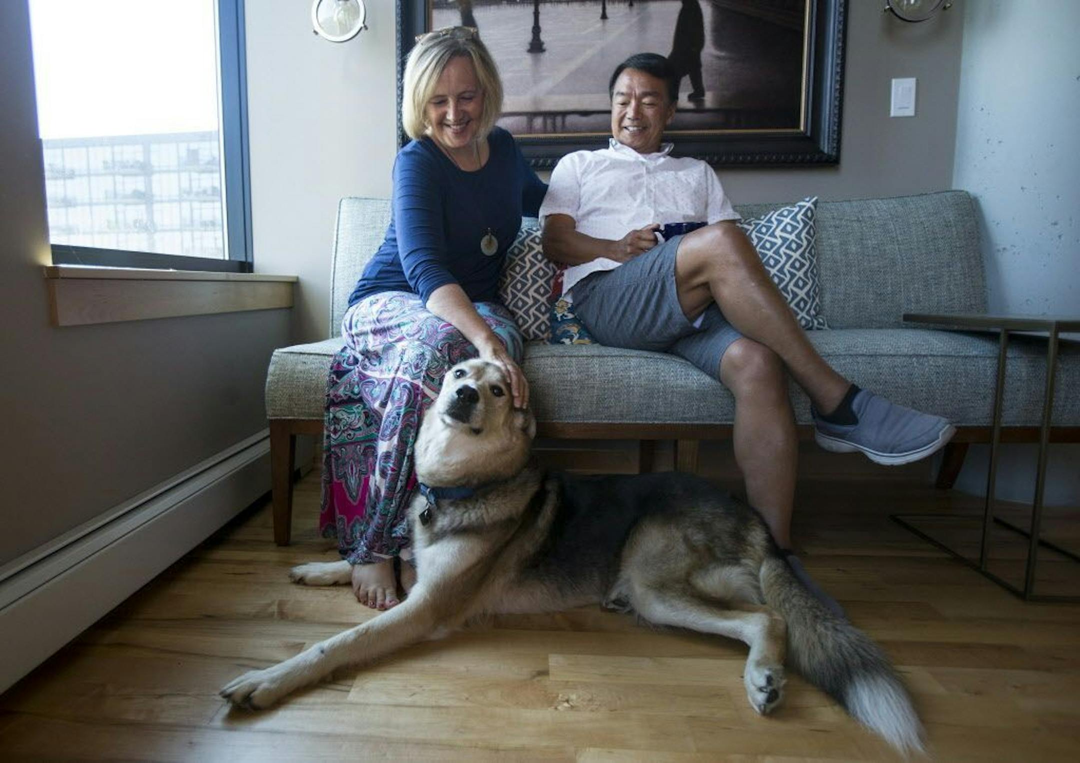 Susie and Matt Law, with Saku, walk just about everywhere from their urban condo, including the Guthrie, restaurants and Gold Medal Park.