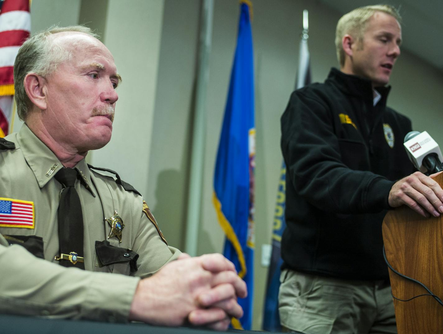 Aitkin County Sheriff Scott Turner listened as BCA Superintendent Drew Evans described the violence at St. Cloud Hospital.