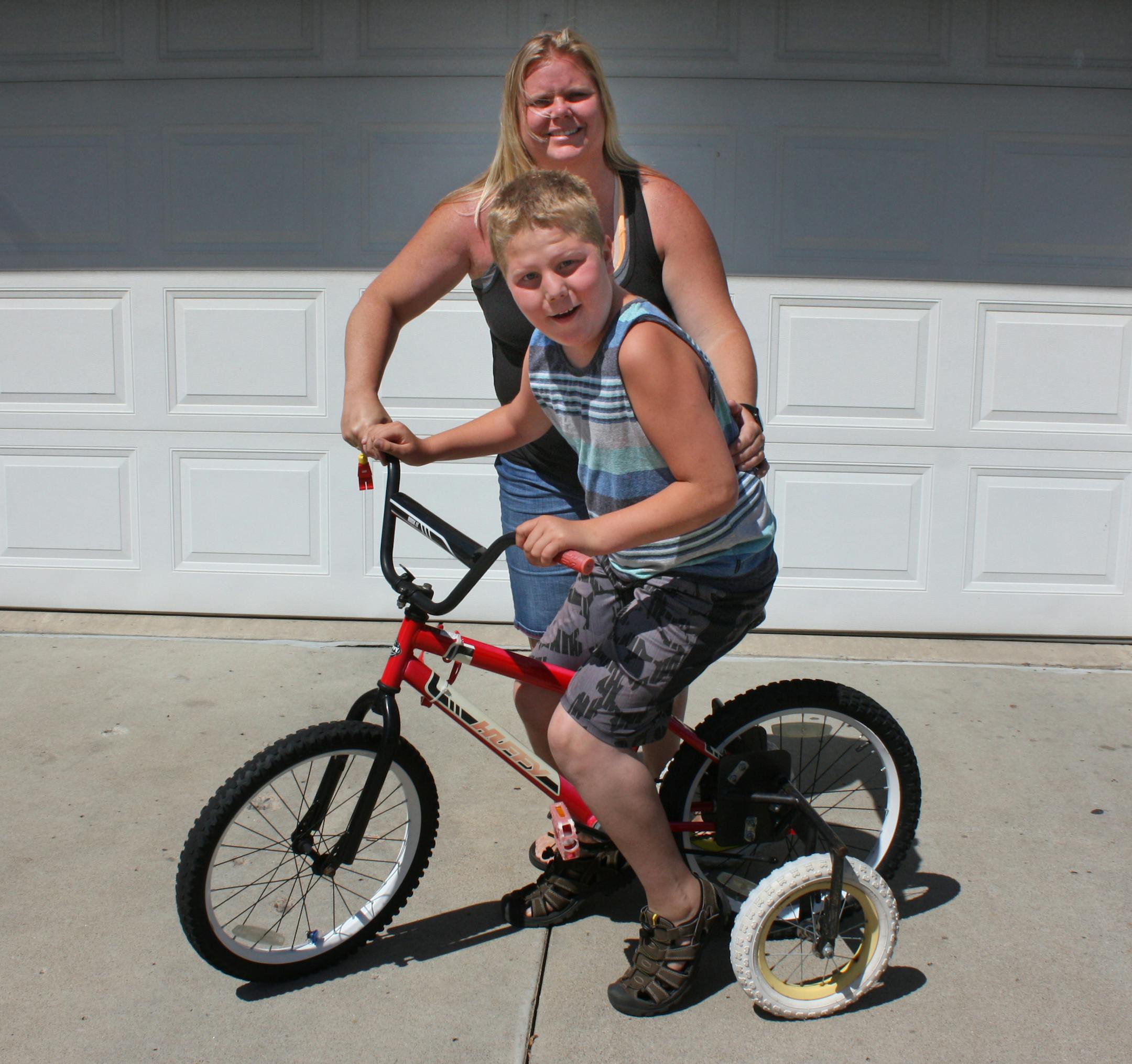 Karla Hemmann, 42, and Dane Hemmann, 12, at their home in Norwood Young America. Karla Hemmann is fundraising for a ìsensory playground,î made with equipment specialized for disabled children, at her sonís school in Jordan. ] Sarah Jarvis, Star Tribune, June 21, 2017, Norwood Young America, Minnesota.
