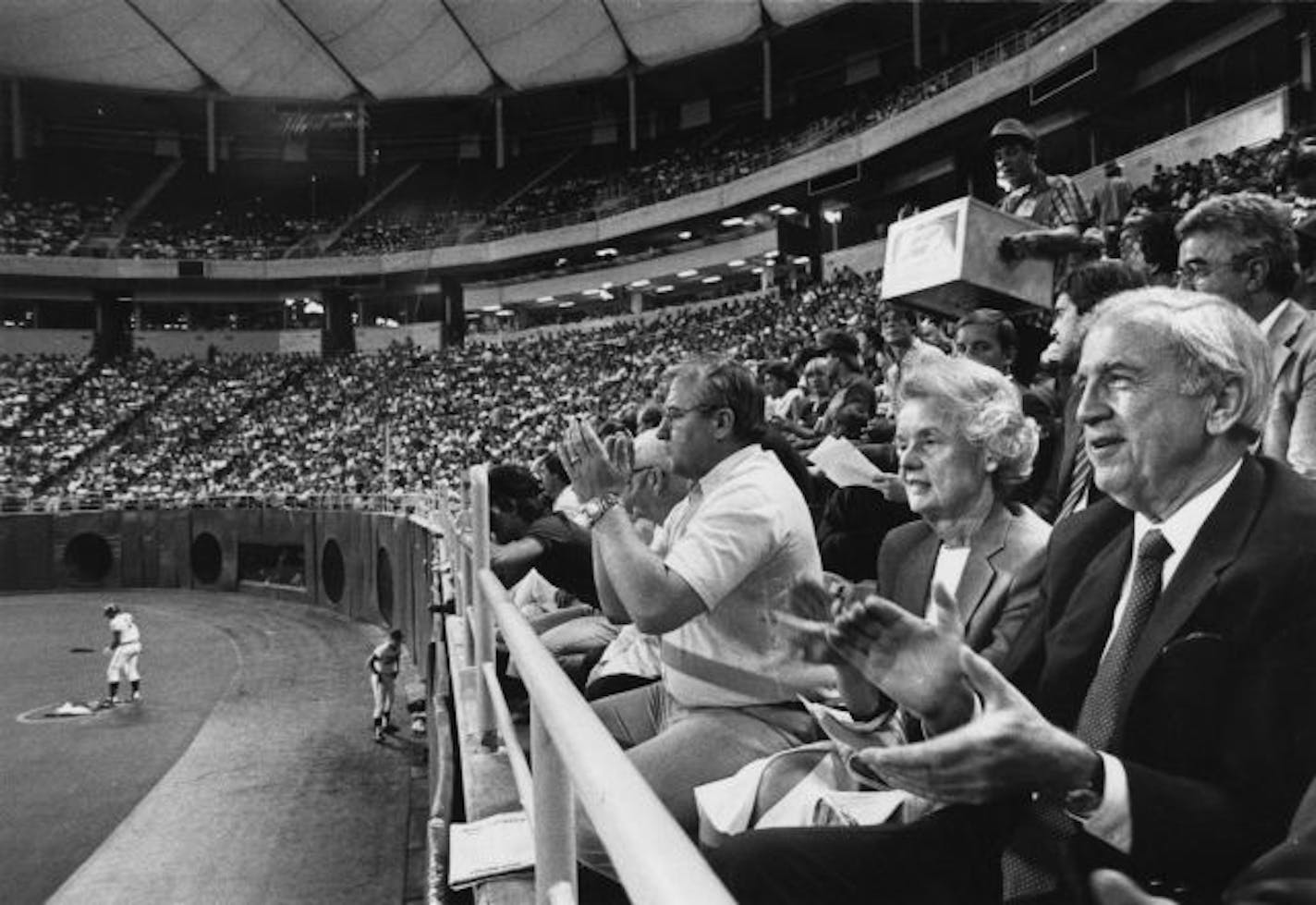 Carl Pohlad and his wife, Eloise, sat his right.