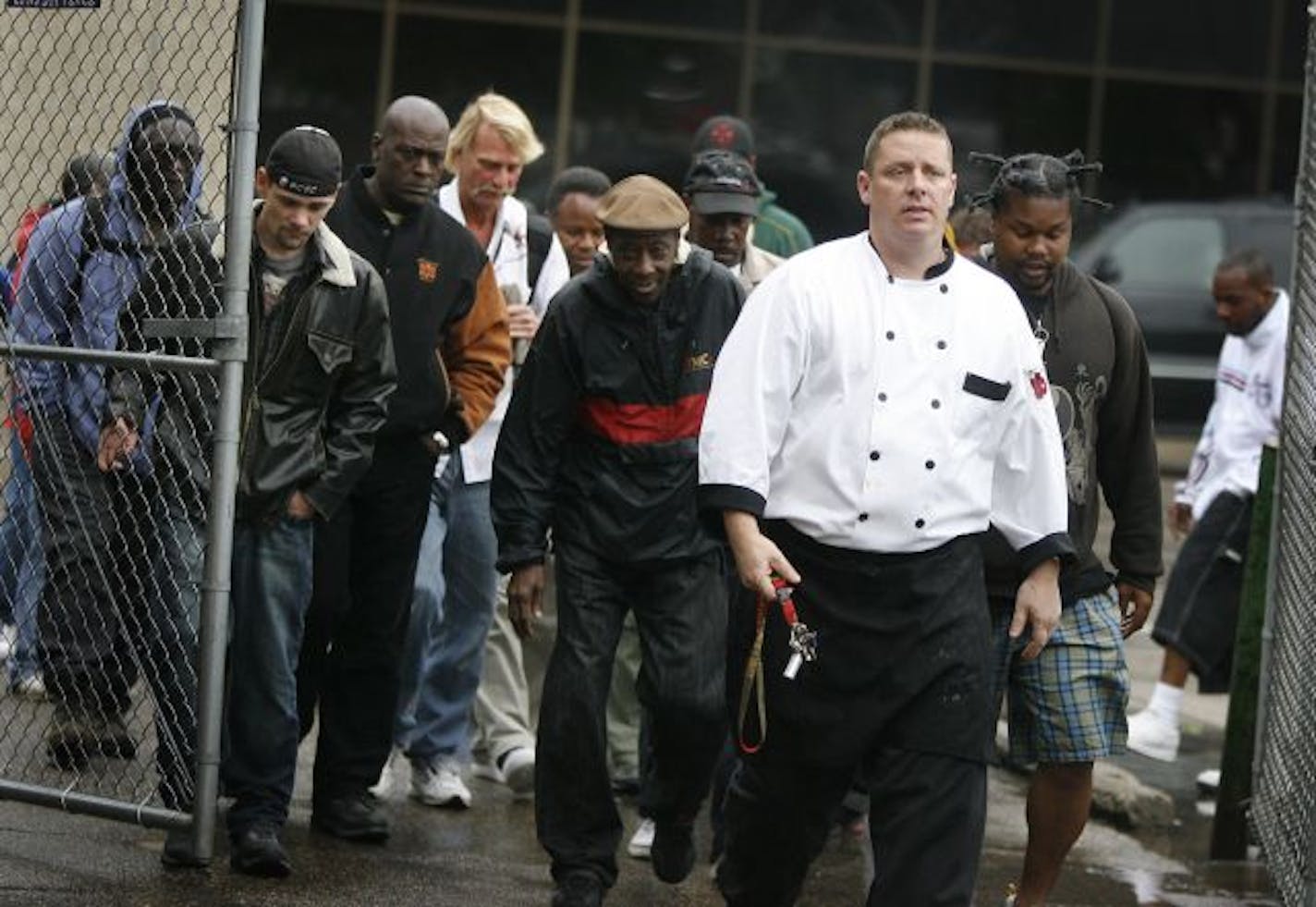 Shortly after feeding two needy groups, Kristoffer Landroche led people into the House of Charity kitchen for lunch on Tuesday.