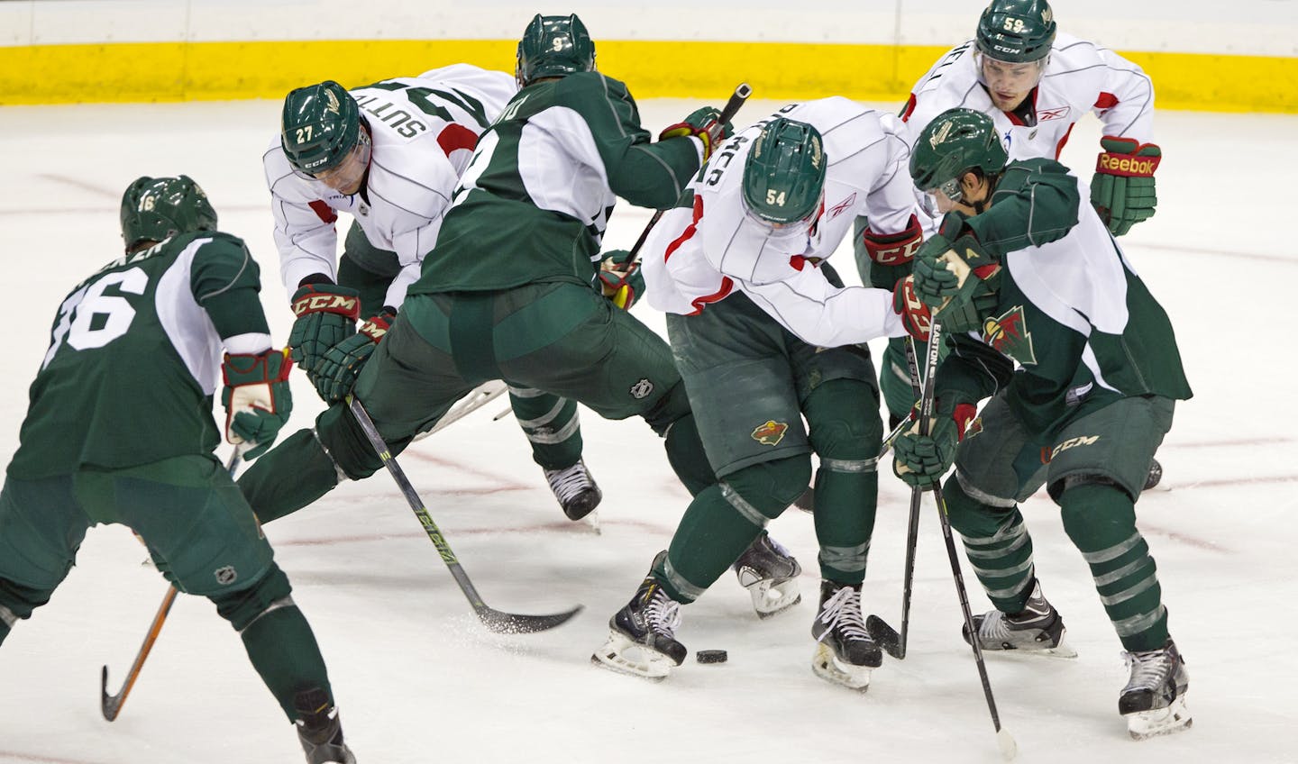 1st Day of School - The Minnesota Wild held their first day of training camp Friday at the Xcel Center in St. Paul. Here, Team A vs Team B scrimmage during the morning practice.] Brian.Peterson@startribune.com St. Paul, MN - 9/18/2015