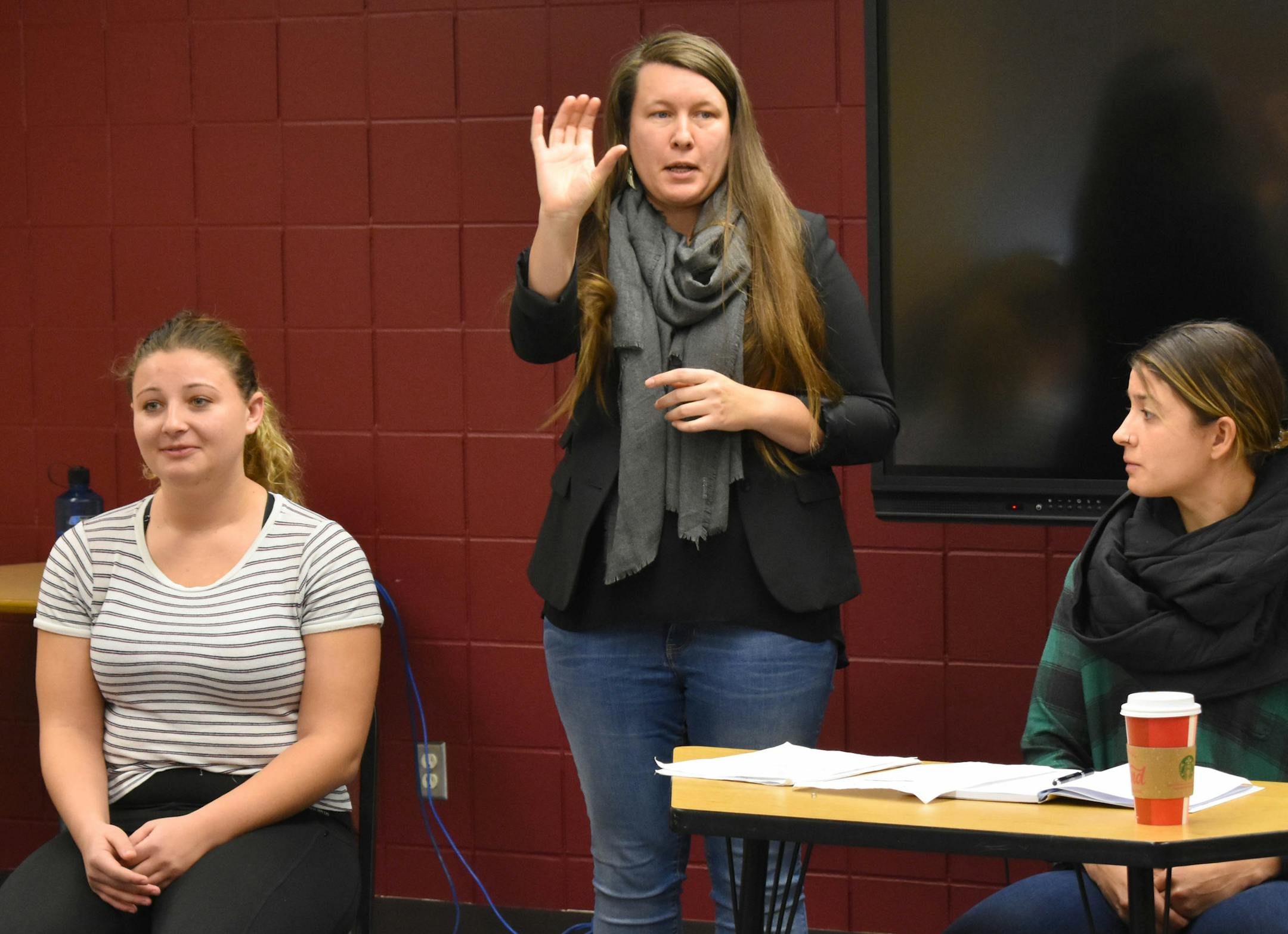 Ariane Schaefer interpreted at the trial as Hamline freshman Maddie Thieschafer, left, and Kelly Rodgers observed.