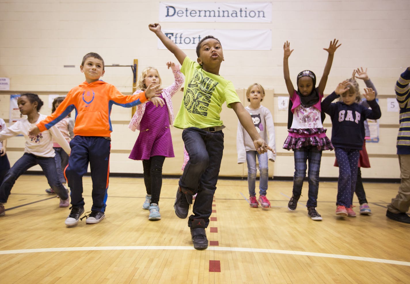 First-grader Nehemiah Epps, center, and his schoolmates freestyled across the gym floor during a dance class at Marcy Open School in Minneapolis. The class is part of a year-long partnership between Cowles Center for Dance and the Performing Arts and the Minneapolis Public Schools.