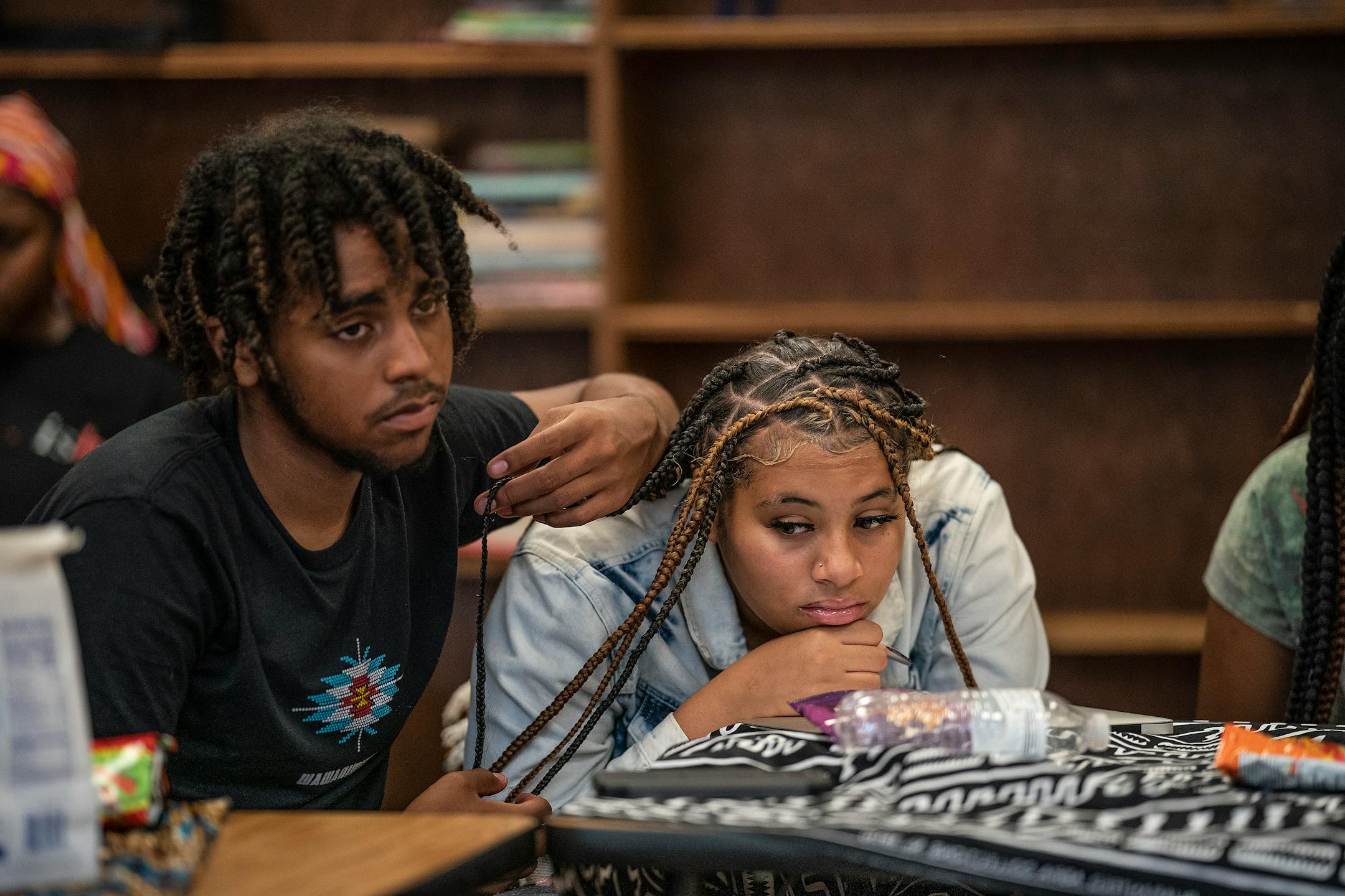 Donnell Pryor left, and Lizaiah Randall listened too Black Storytellers Vusumuzi Zulu and his wife Nothando Zulu as they spoke to a morning English class at Edison High School.