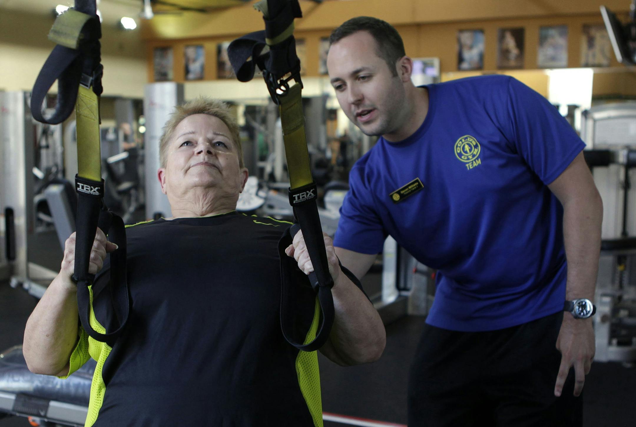 Pat Wagner, left, works out with personal trainer Steven Williams at Gold's Gym in Dallas, Texas, on July 5, 2013. Wagner is motivated by Williams' tweets about living a healthy lifestyle. (Sarah Hoffman/Dallas Morning News/MCT) ORG XMIT: 1142170