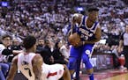 Philadelphia 76ers guard Jimmy Butler (23) looks to pass as Toronto Raptors guard Kyle Lowry (7) falls while defending during first-half, second-round
