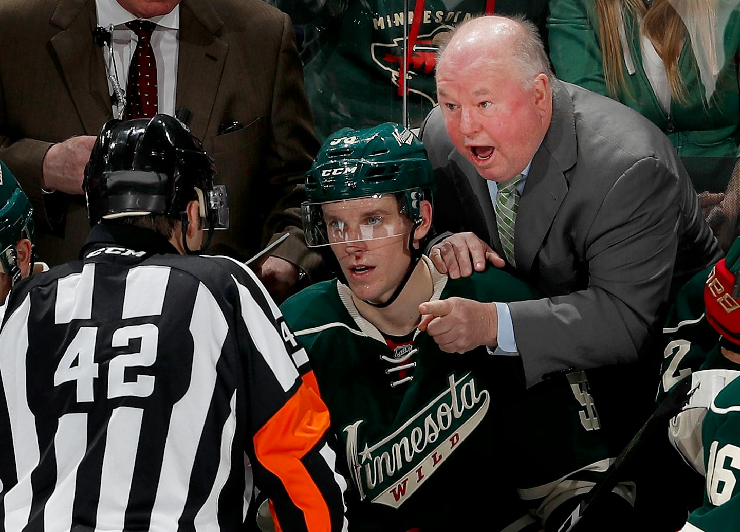 Wild coach Bruce Boudreau talked to Jake Brenk, a referee splitting time between the NHL and AHL, on Sunday.