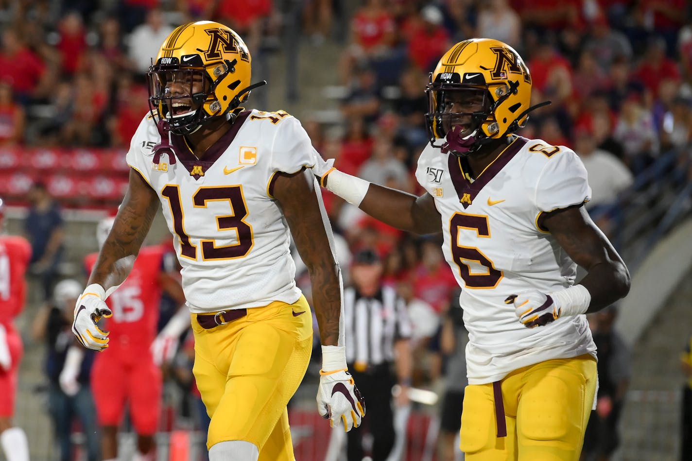 Gophers wide receivers Rashod Bateman (13) and Tyler Johnson (6) celebrated after a touchdown by Bateman on the opening drive vs. Fresno State earlier this season.