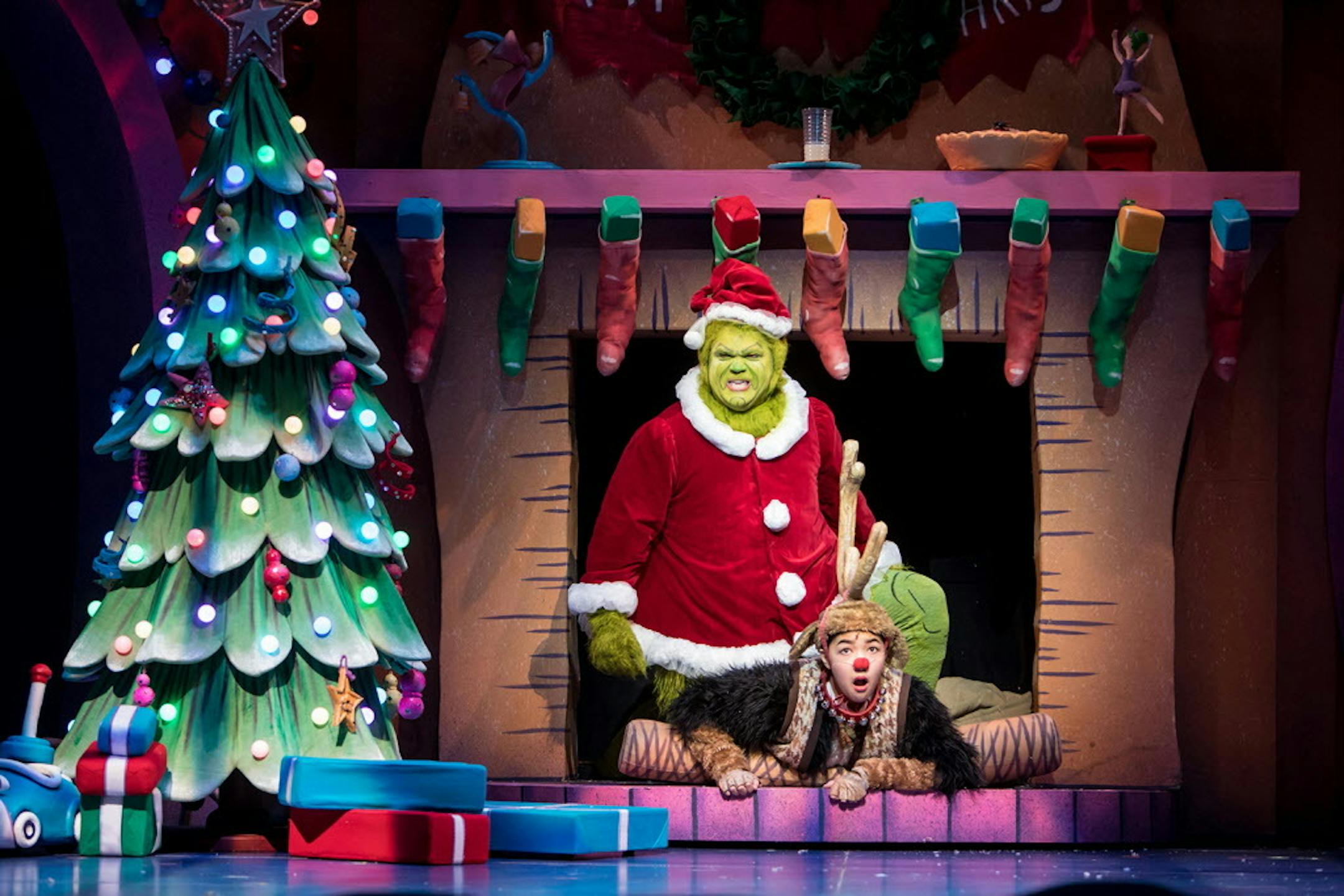 Reed Sigmund as the Grinch and Natalie Tran as Young Max in "Dr. Seuss' How the Grinch Stole Christmas!" at Children's Theatre Company.