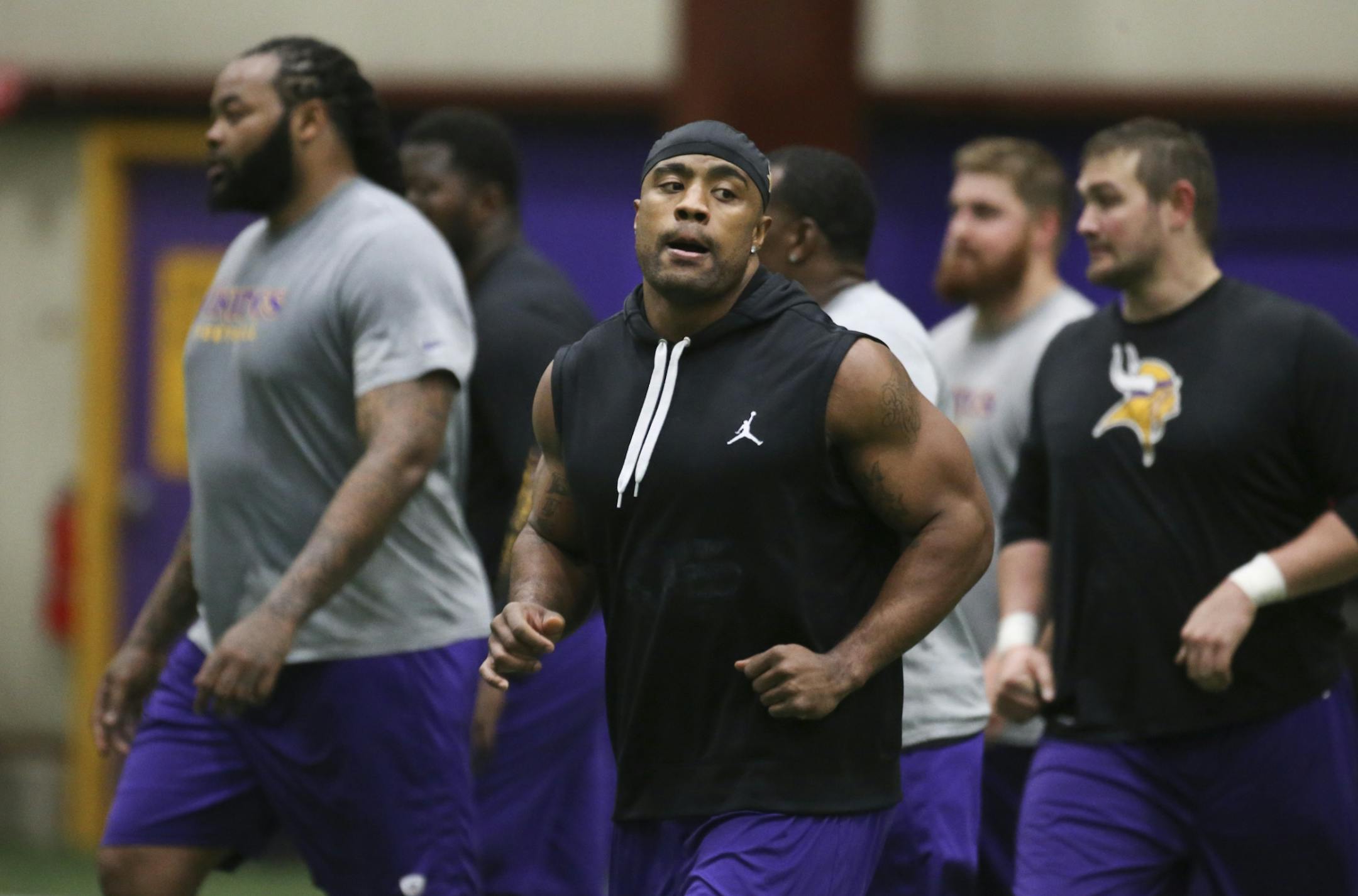 The Minnesota Vikings Everson Griffen, center, and Phil Loadholt, left, following offseason training Tuesday, April 15, 2014, at Winter Park in Eden Prairie, MN.