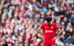 Liverpool's Mohamed Salah reacts during the English Premier League soccer match between Liverpool and Crystal Palace at Anfield Stadium in Liverpool, 