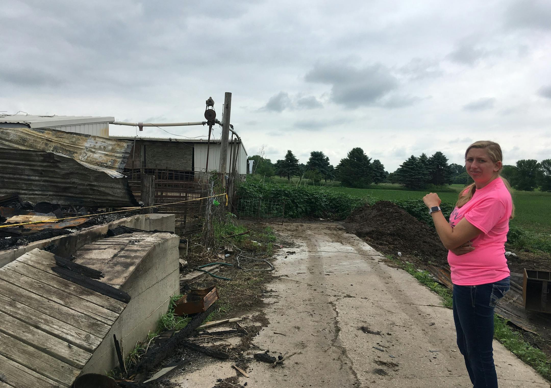 By Erin Adler. Rachel Stancer-Prokop stands outside the barn that burned down in late May.