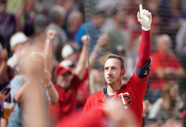 Minnesota Twins catcher Mitch Garver (18) gave a curtain call from the dugout after hitting a game winning, two-run home run in the eighth inning. ] A