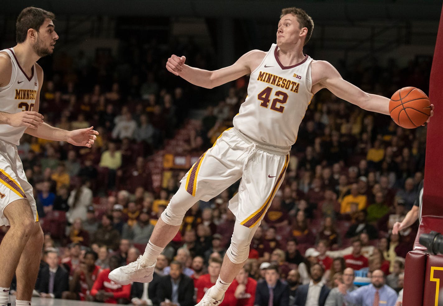 Gophers forward Michael Hurt had five points and a career-high seven assists in 20 minutes against Nebraska on Sunday, but his biggest assist came after the Senior Day game with a pitch to local prospects about staying home to play for the Gophers.