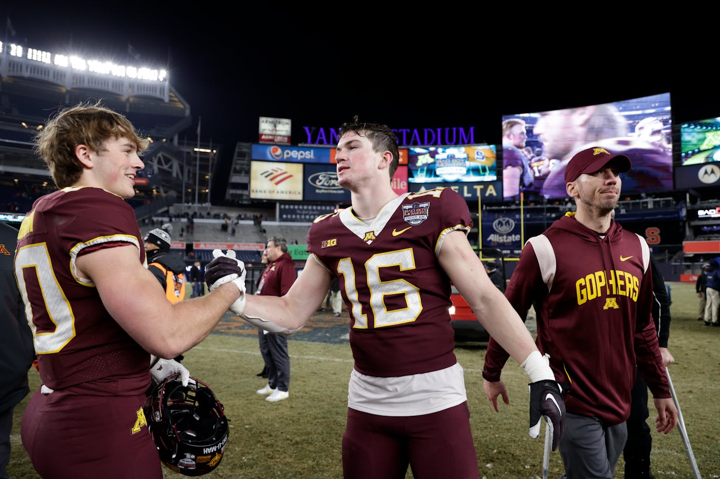 Minnesota defensive back Coleman Bryson (16) celebrates with teammates after the team defeated Syracuse in the Pinstripe Bowl.